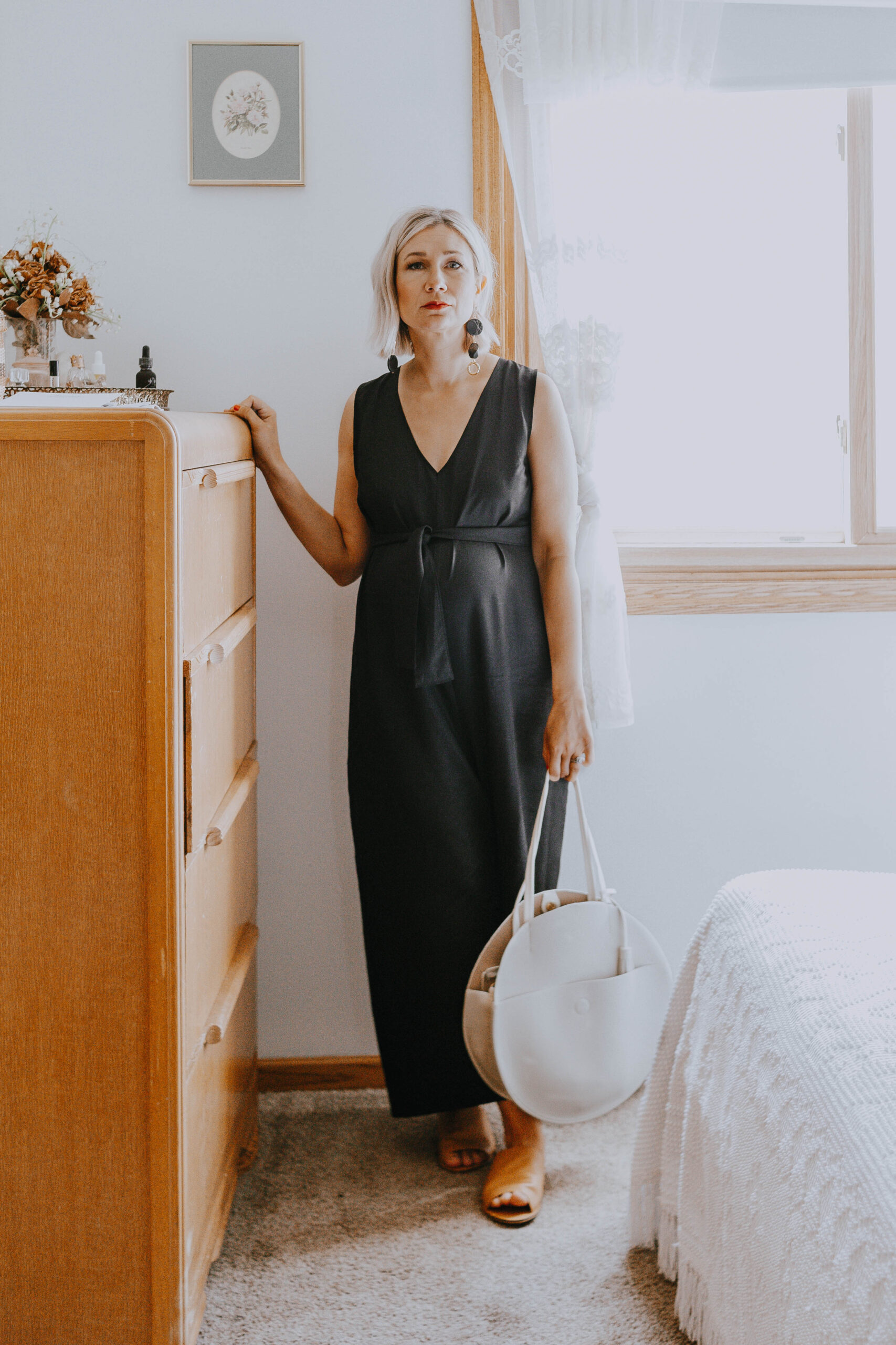 What I Wore Last Week: black jumpsuit and white circle bag