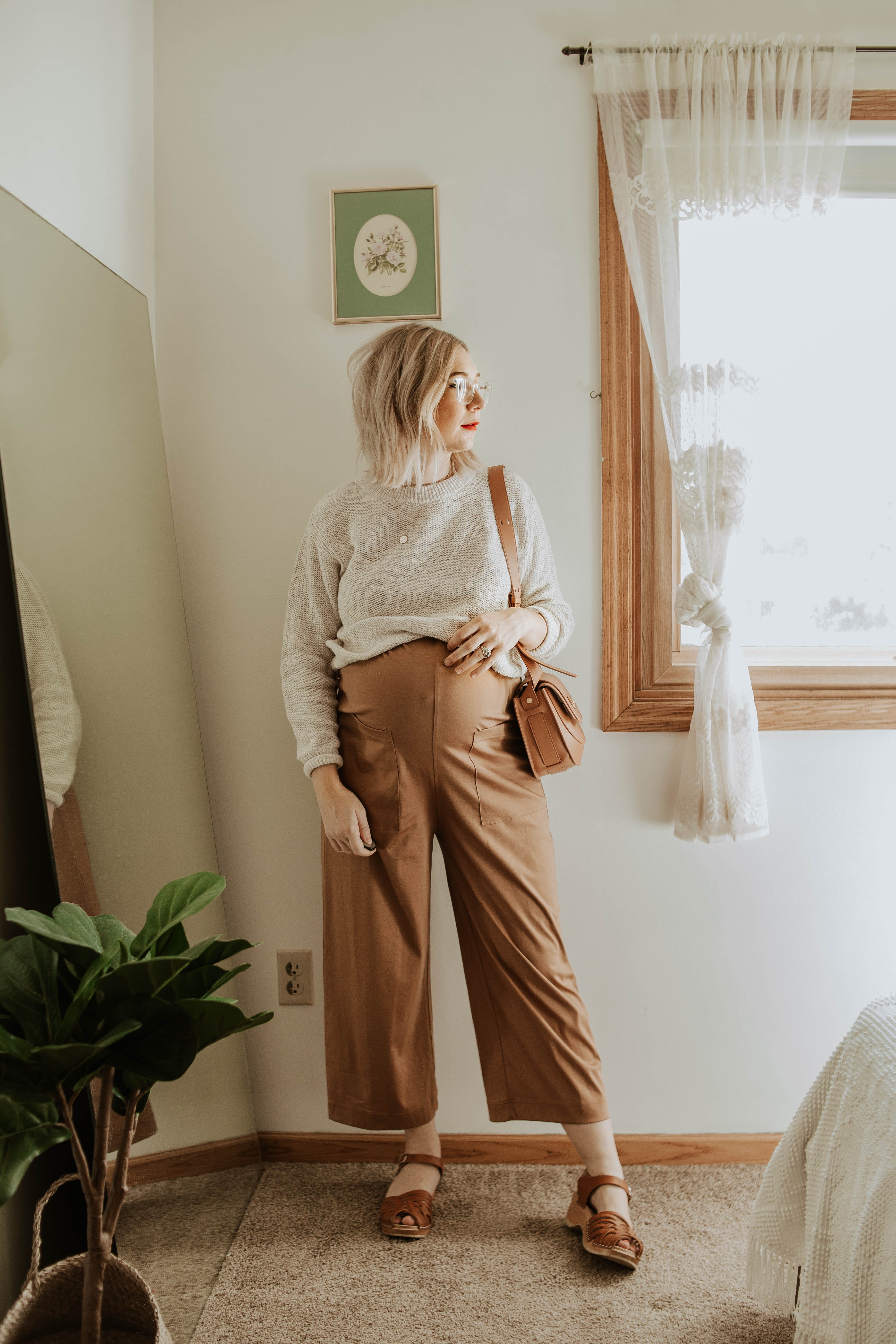 Transitional Summer to Fall Outfitseverlane cotton jumpsuit toasted almond, everlane cotton sweater, friday by jwpei brown saddle bag, troentorp clogs, ann clogs