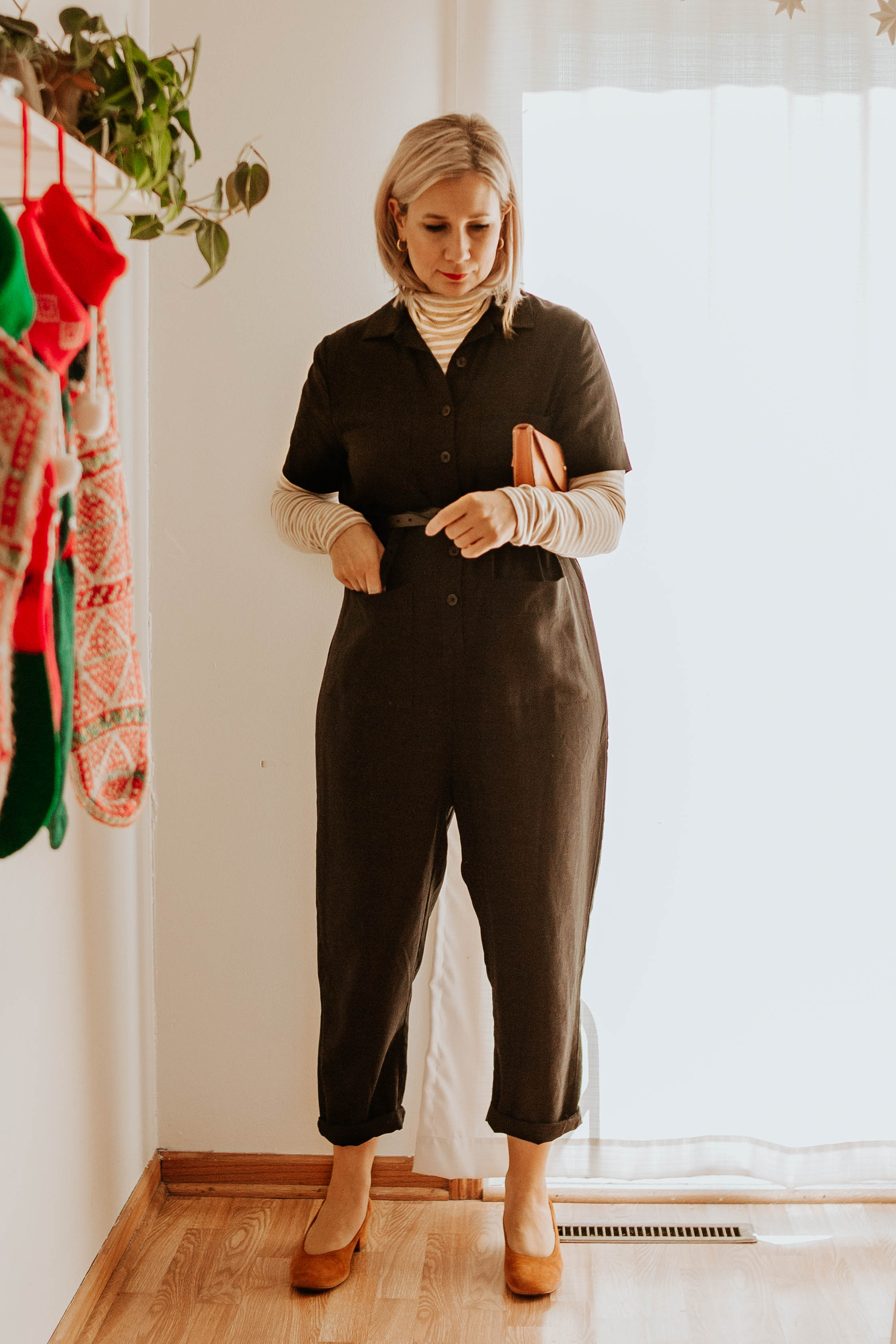 Mini Holiday Lookbook Featuring Ethical Fashion, tradlands jumpsuit, black short sleeve jumpsuit, everlane day heels, striped turtleneck, turtleneck under jumpsuit, tree fairfax bum bag, belt bag