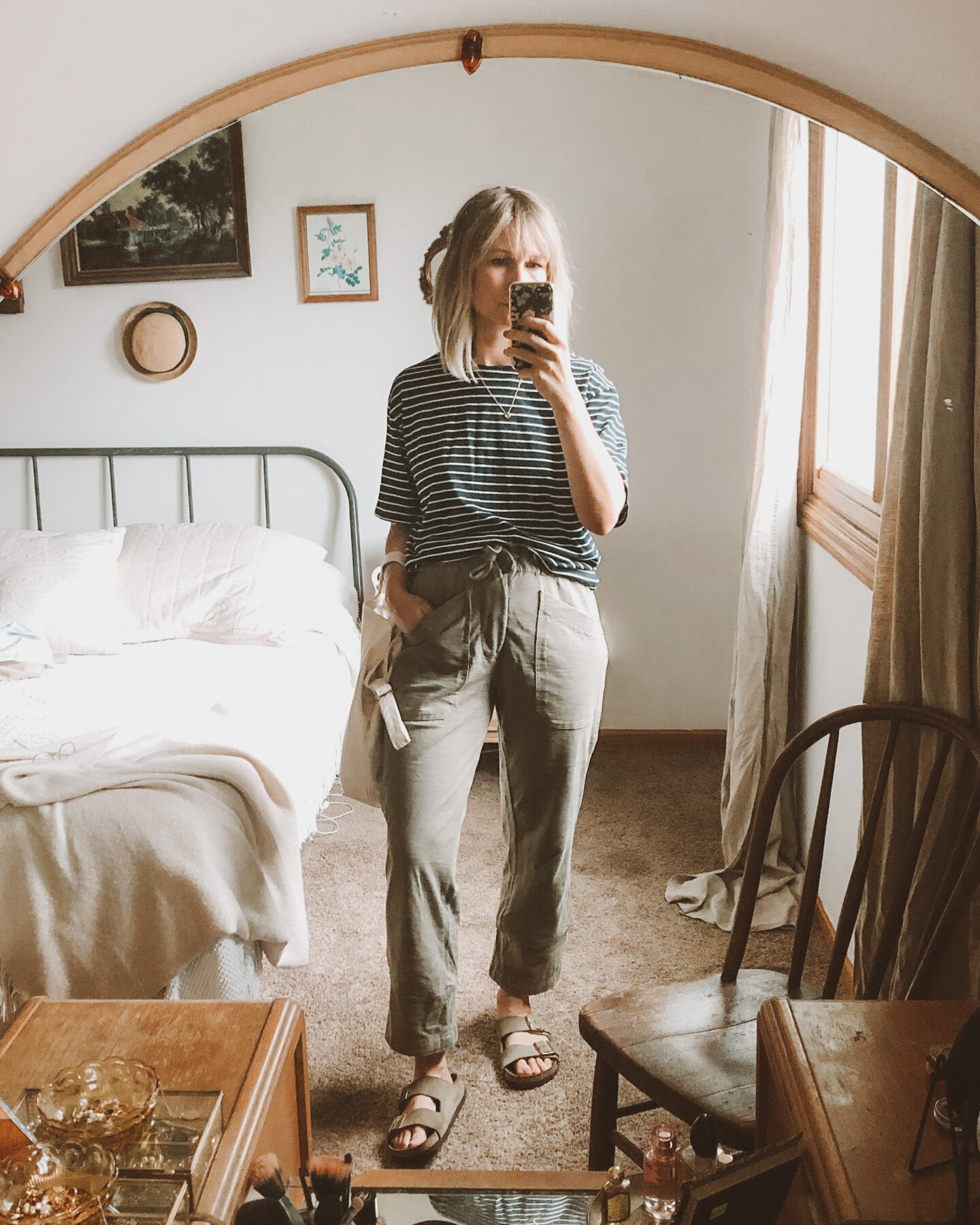 Fall Transitional Dressing: loungewear outfit with a striped navy and white tee, khaki green or olive green sweatpants, and birkenstock arizonas