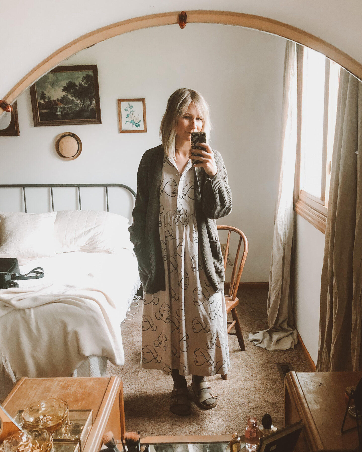 Fall Transitional Dressing: forest green cardigan over a dress with socks and birkenstocks