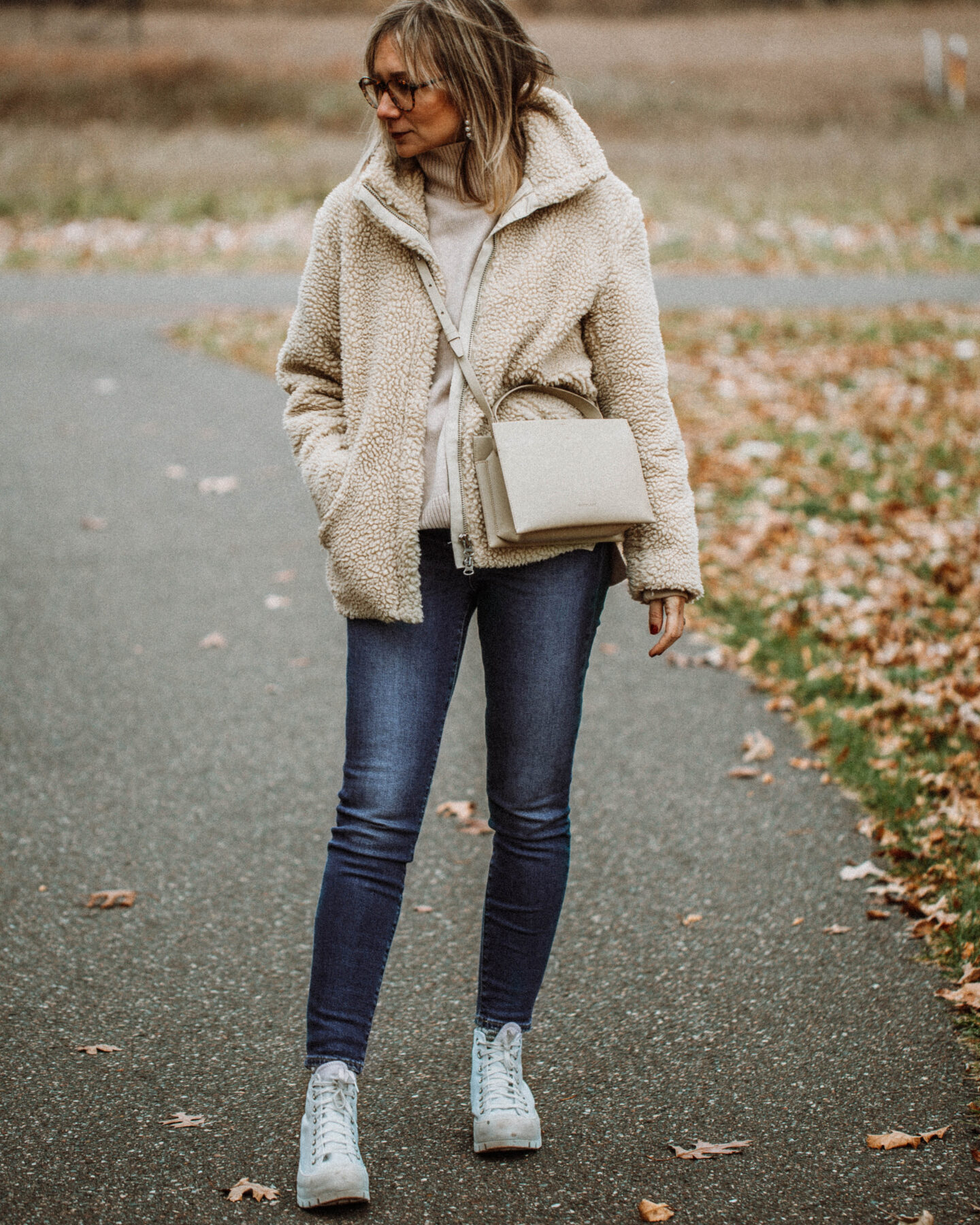 3 Cozy Outfits for Thanksgiving, Karin Emily Style - Faux Fur Sherpa Coat, Turtleneck Sweater, Mid Wash Skinny Jeans, Converse White Lug Sole High Tops