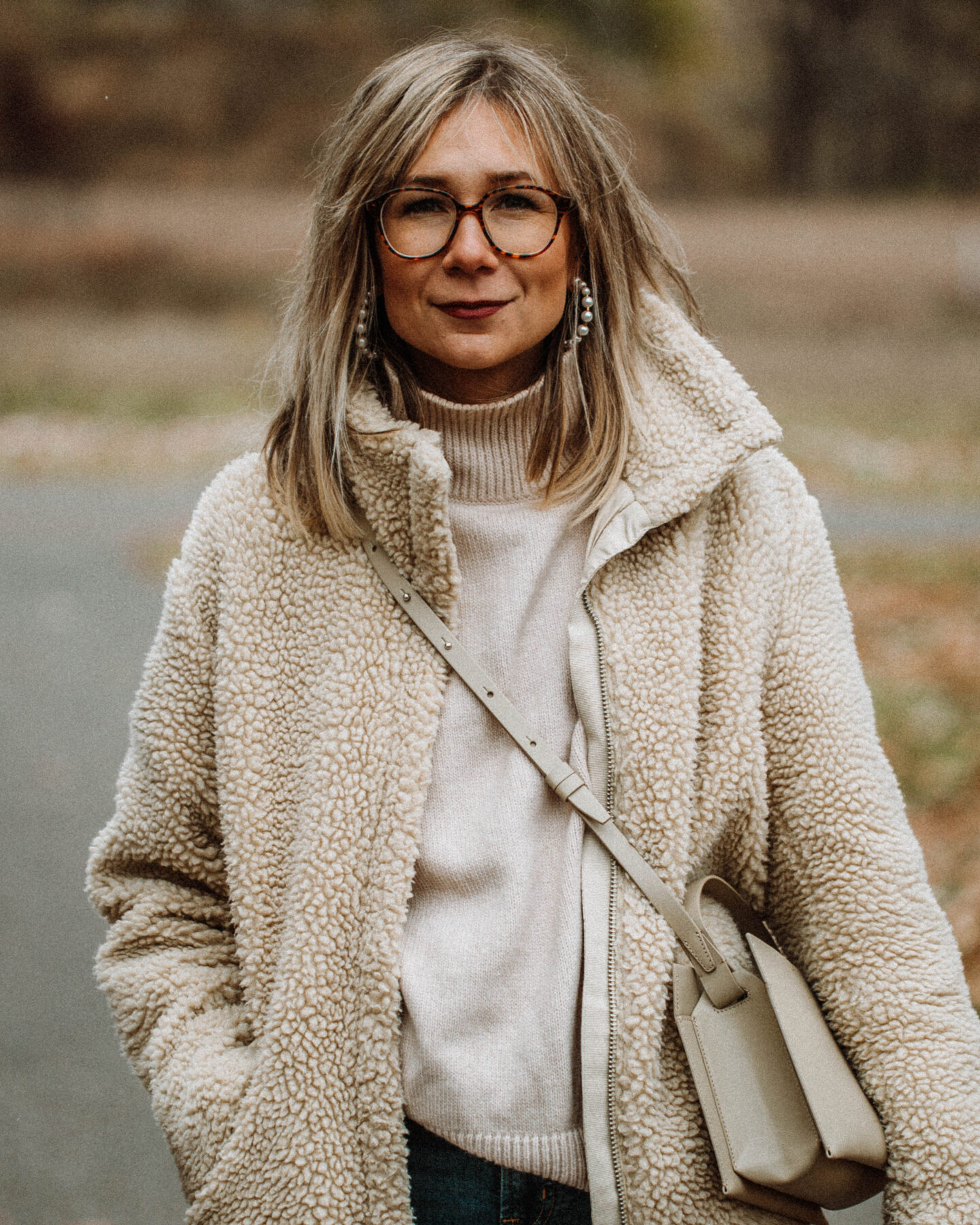 3 Cozy Outfits for Thanksgiving, Karin Emily Style - Faux Fur Sherpa Coat, Turtleneck Sweater, Mid Wash Skinny Jeans, Converse White Lug Sole High Tops