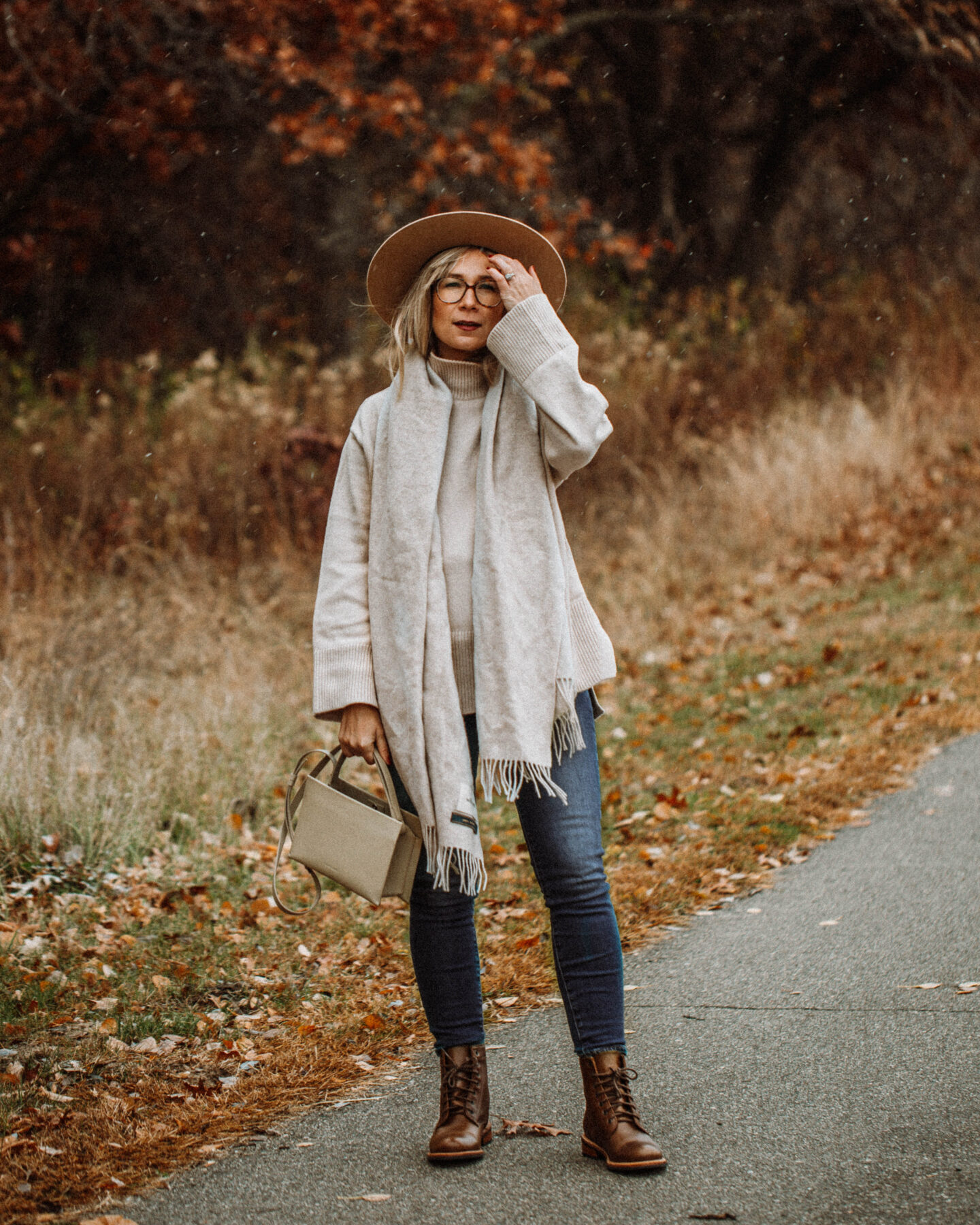 3 Cozy Outfits for Thanksgiving. Karin Emily Style - Beige Wool Scarf, Turtleneck Oversized Sweater, Mid Wash Skinny Jeans, Taupe Bag, Gigi Pip Boater Hat, Brown Lace Up Boots