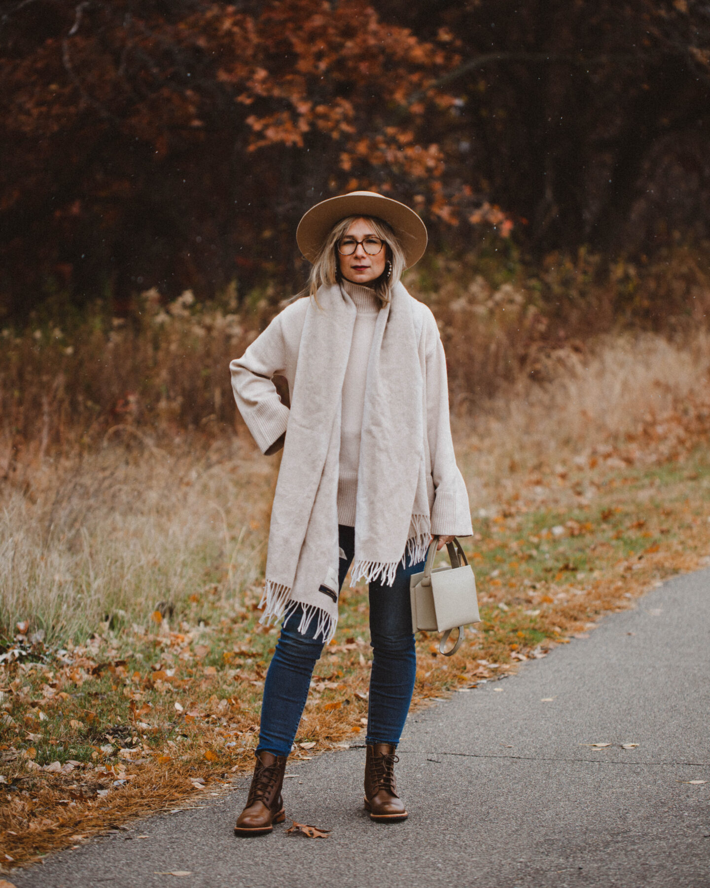 3 Cozy Outfits for Thanksgiving. Karin Emily Style - Beige Wool Scarf, Turtleneck Oversized Sweater, Mid Wash Skinny Jeans, Taupe Bag, Gigi Pip Boater Hat, Brown Lace Up Boots