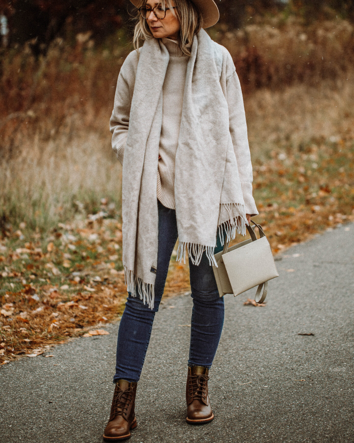 3 Cozy Outfits for Thanksgiving. Karin Emily Style - Beige Wool Scarf, Turtleneck Oversized Sweater, Mid Wash Skinny Jeans, Taupe Bag, Gigi Pip Boater Hat, Brown Lace Up Boots