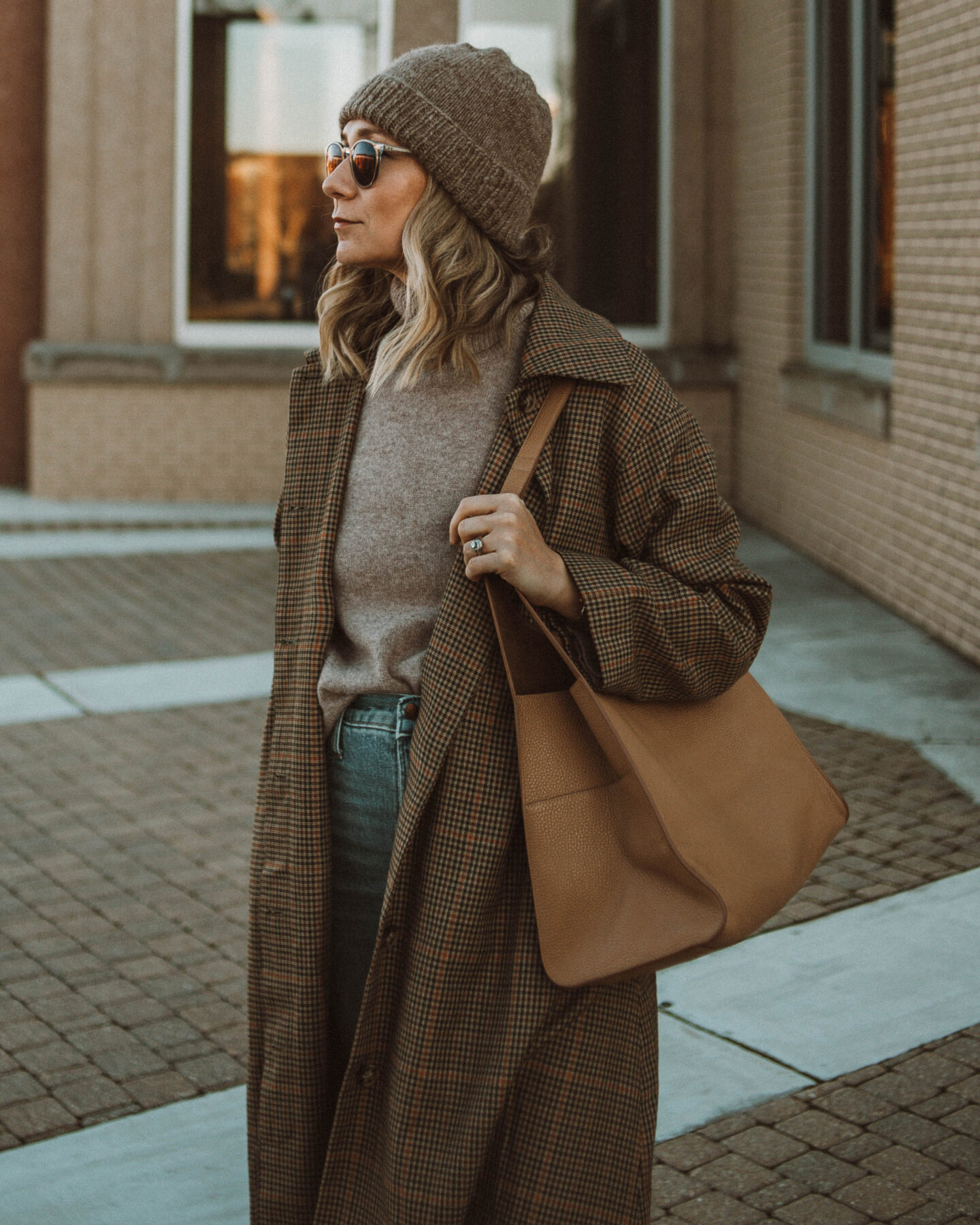 cozy, stay at home outfits madewell perfect vintage jeans, toteme coat, toteme sweater, beige turtleneck sweater, white sneakers, plaid coat, cuyana hobo bag, brown toque