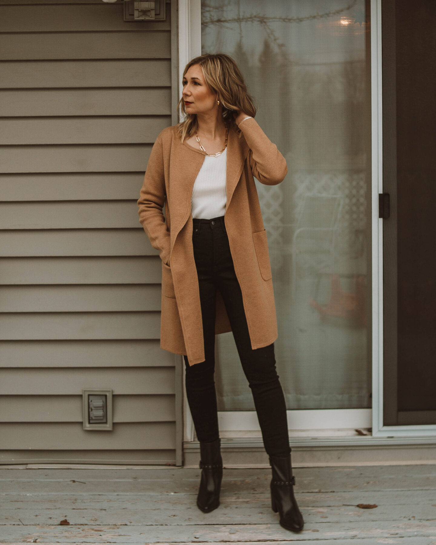cozy at home christmas outfit ideas, black skinny jeans, camel cardigan, black heeled boots
