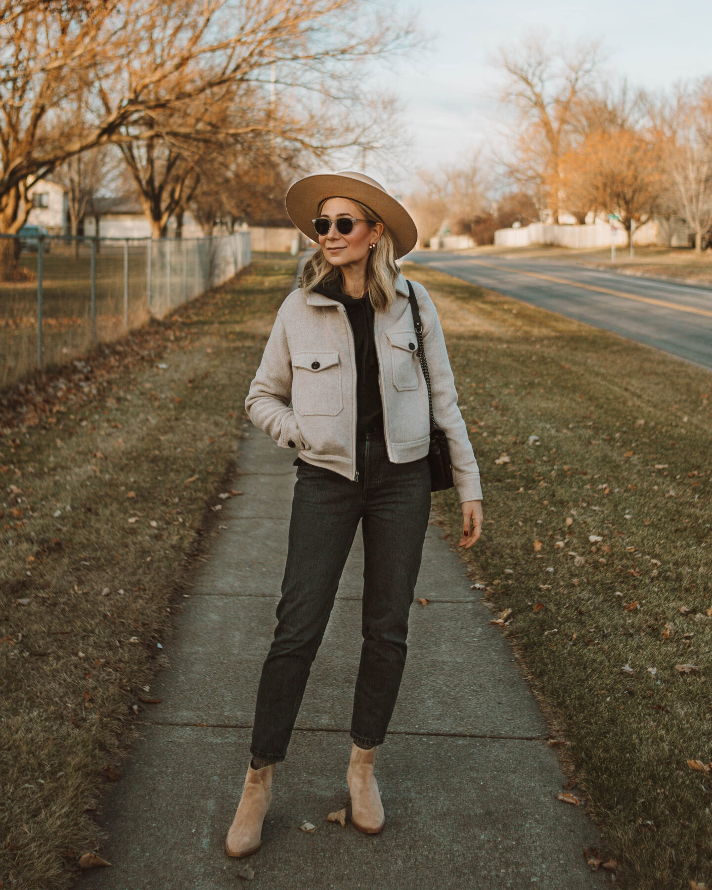 cold weather favorites: new in at everlane, anorak jacket, 90's cheeky jean, black hooded sweatshirt, western boot, taupe bootie, gigi pip boater hat tan