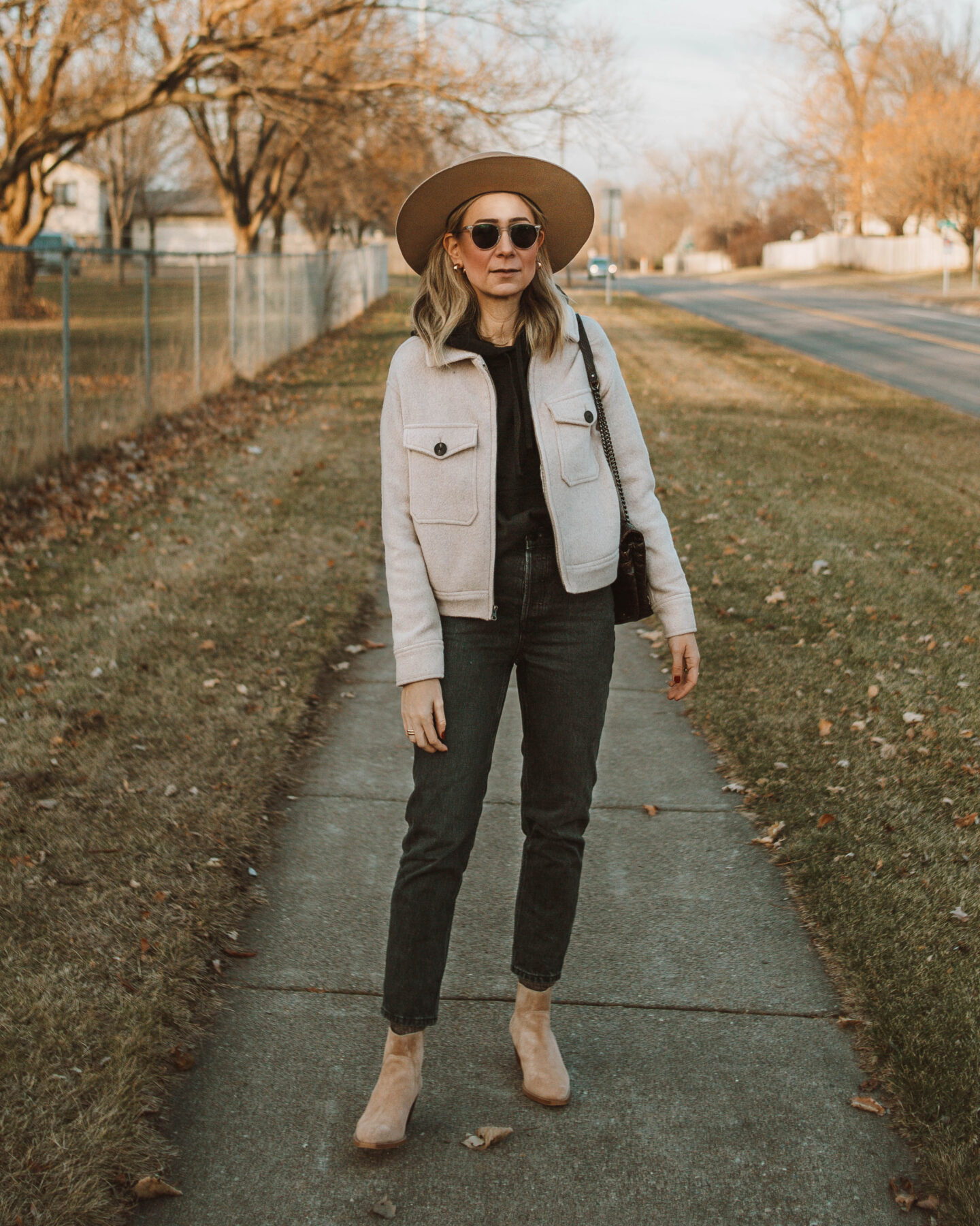 cold weather favorites: new in at everlane, anorak jacket, 90's cheeky jean, black hooded sweatshirt, western boot, taupe bootie, gigi pip boater hat tan