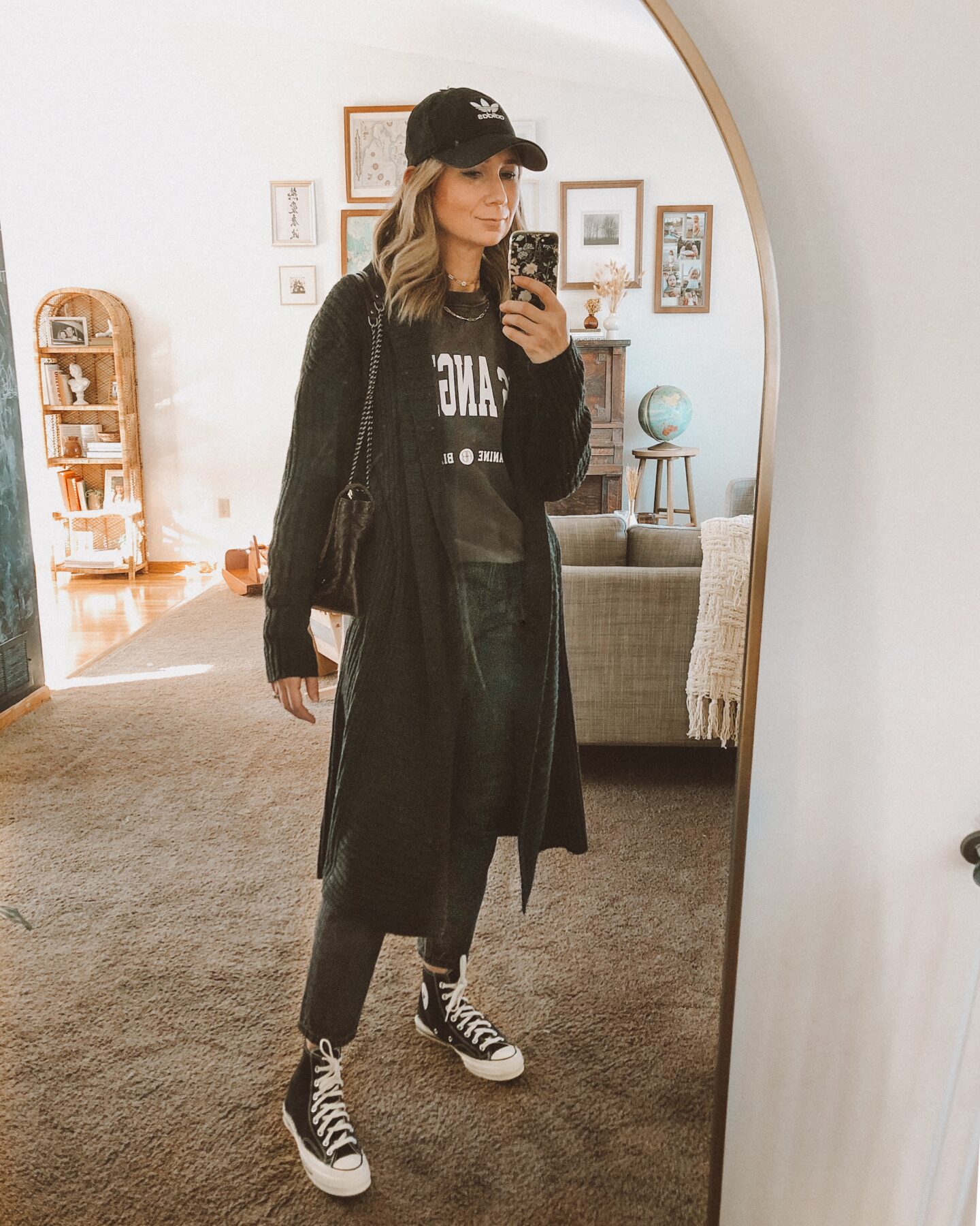 aninebing sweatshirt, graphic sweatshirt, everlane 90's cheeky jean, black high top converse, black adidas baseball cap, rebekah minkoff flap bag