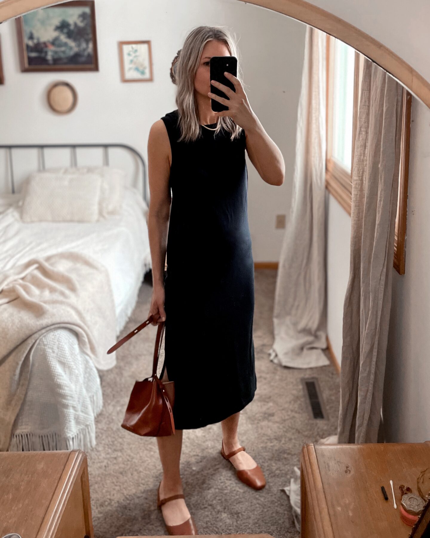 4 ways to style your favorite black midi dress