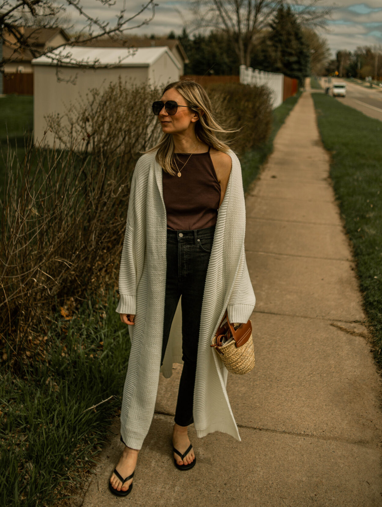 black jeans, brown tank top, cream maxi cardigan