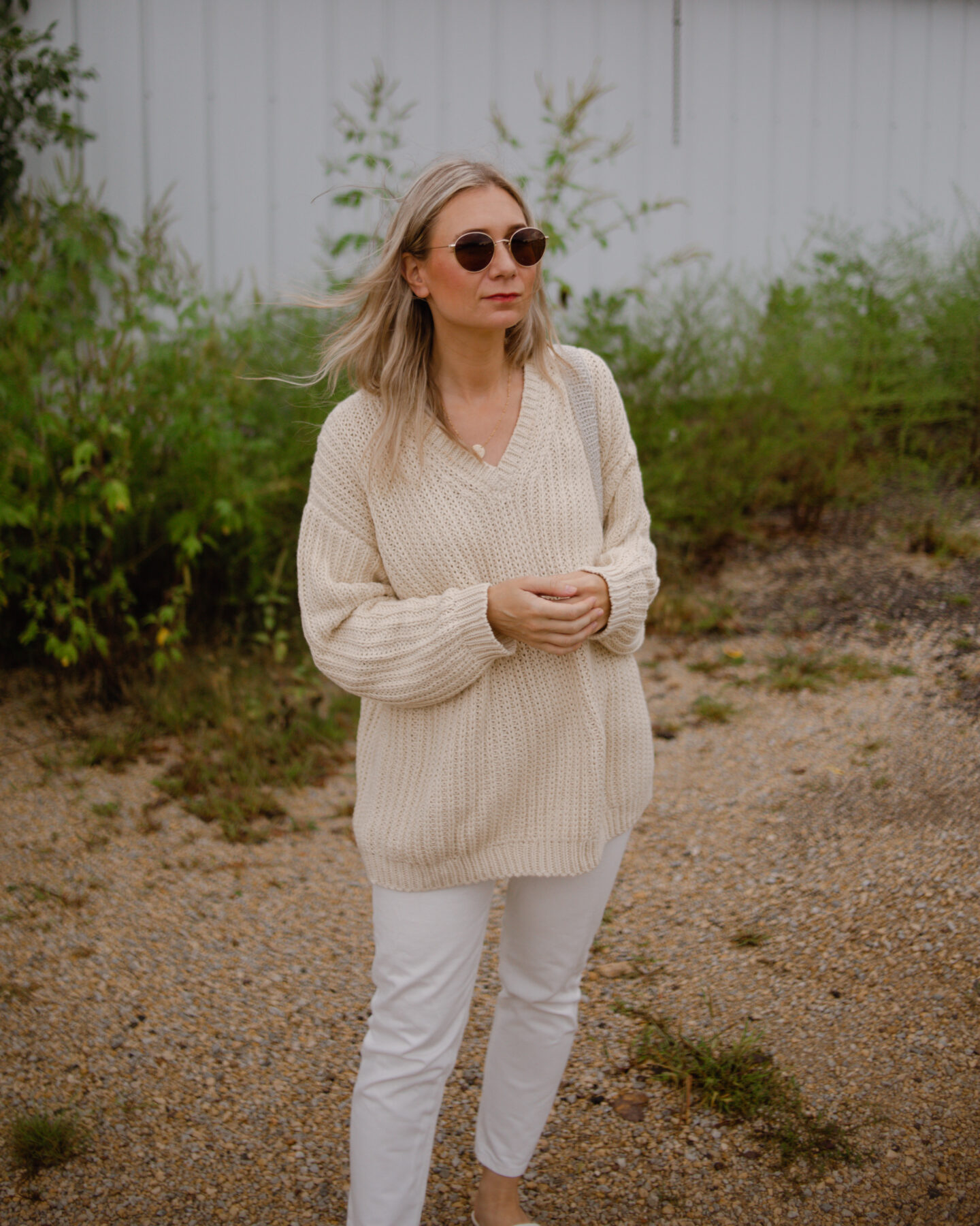 Karin Emily wearing Jenni Kayne Cotton Cabin Sweater and white everlane 90's cheeky jeans