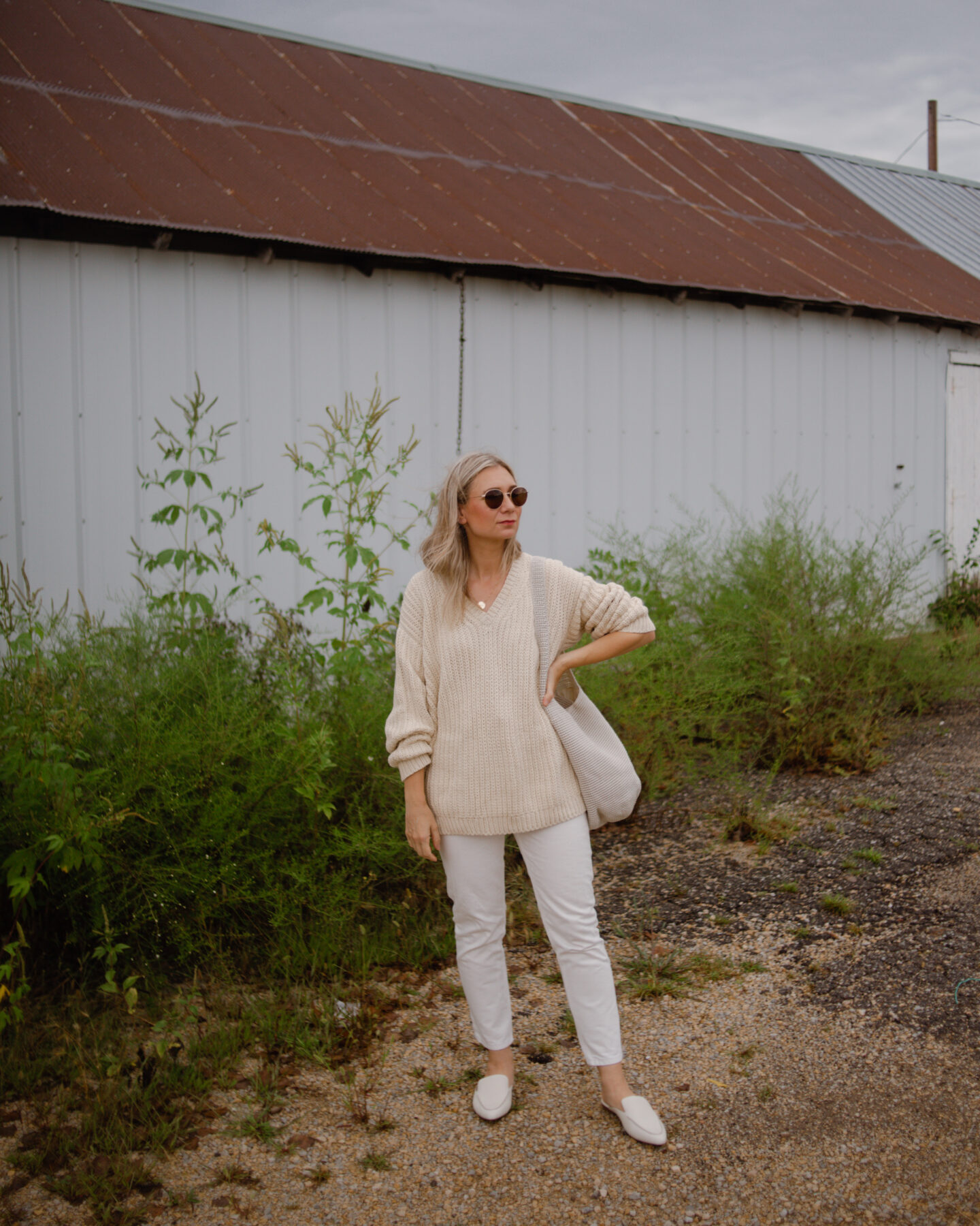 Karin Emily wearing Jenni Kayne Cotton Cabin Sweater and white everlane 90's cheeky jeans and white mules