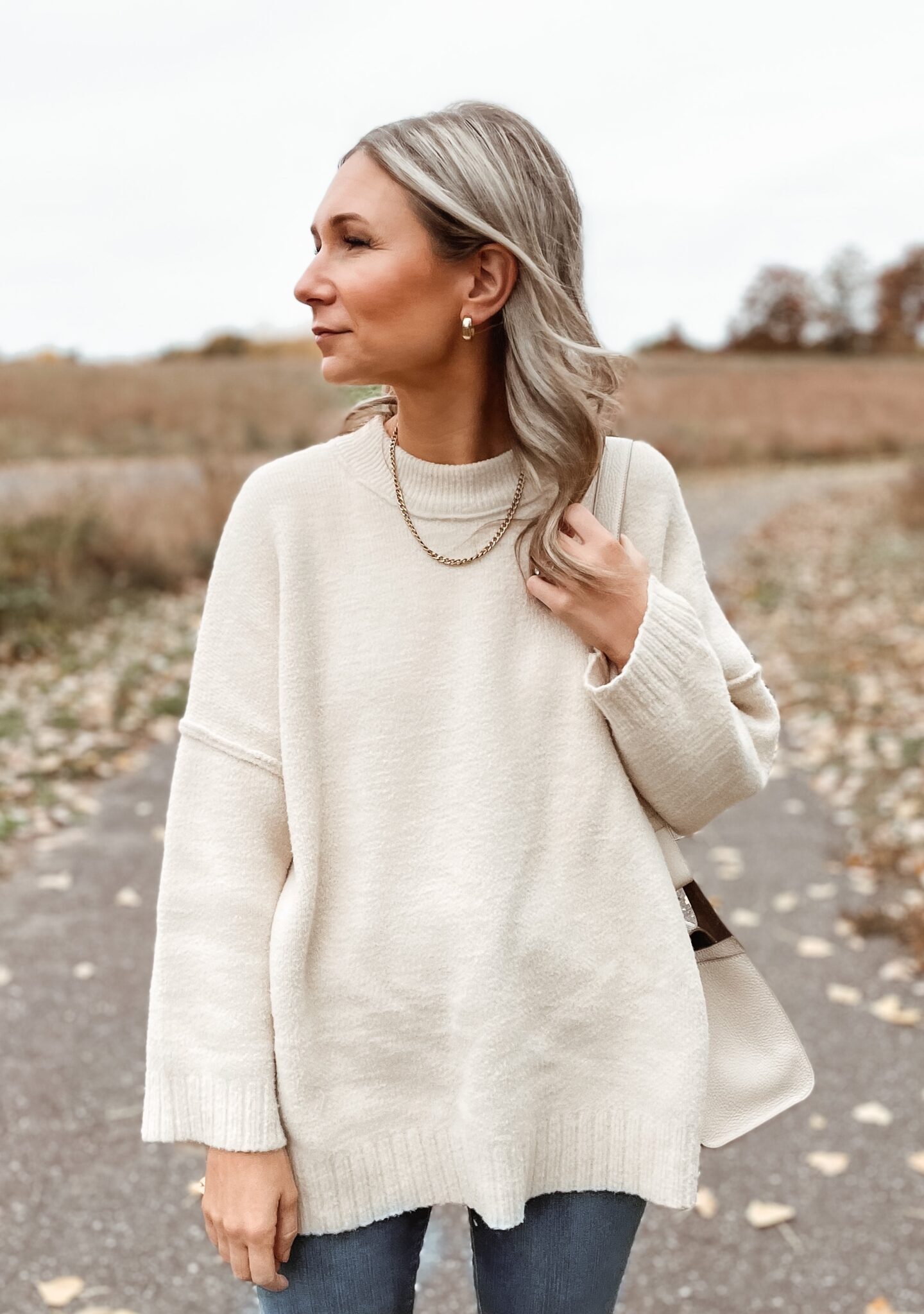 Karin Emily wears the Peaches sweater from Free People