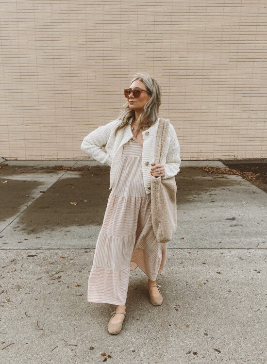 Karin Emily wears a fall maxi dress with an everlane cropped cardigan, velvet Mary Jane's, oversized sunglasses and a sherpa bag