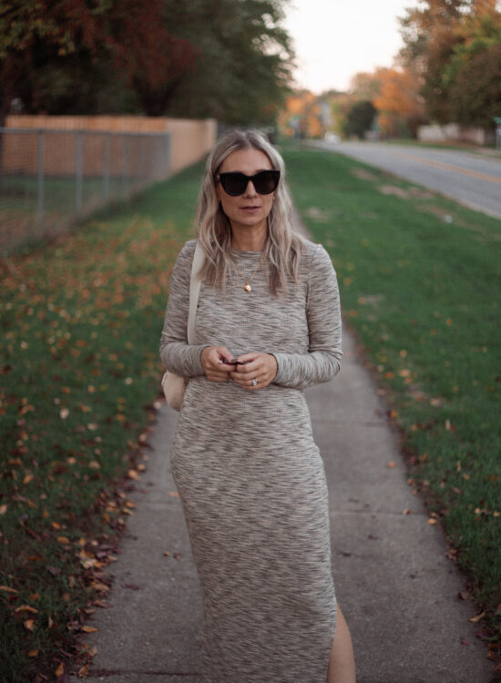 Karin Emily wears a long fall maxi dress with a pair of off white high top converse and oversized black le spec air heart sunglasses