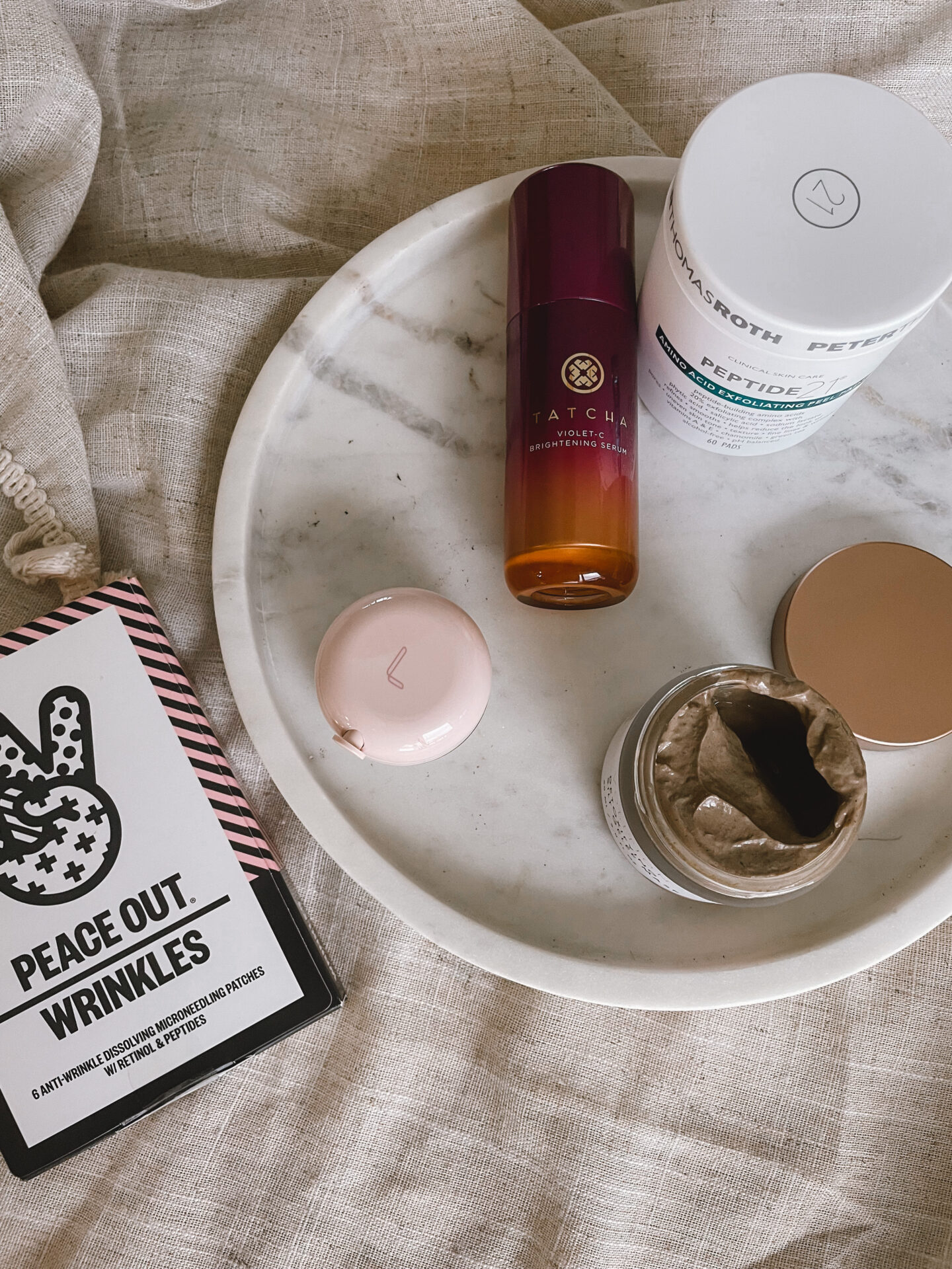 Karin Emily shares a flat lay of her favorite skincare from the Sephora Holiday Savings Event