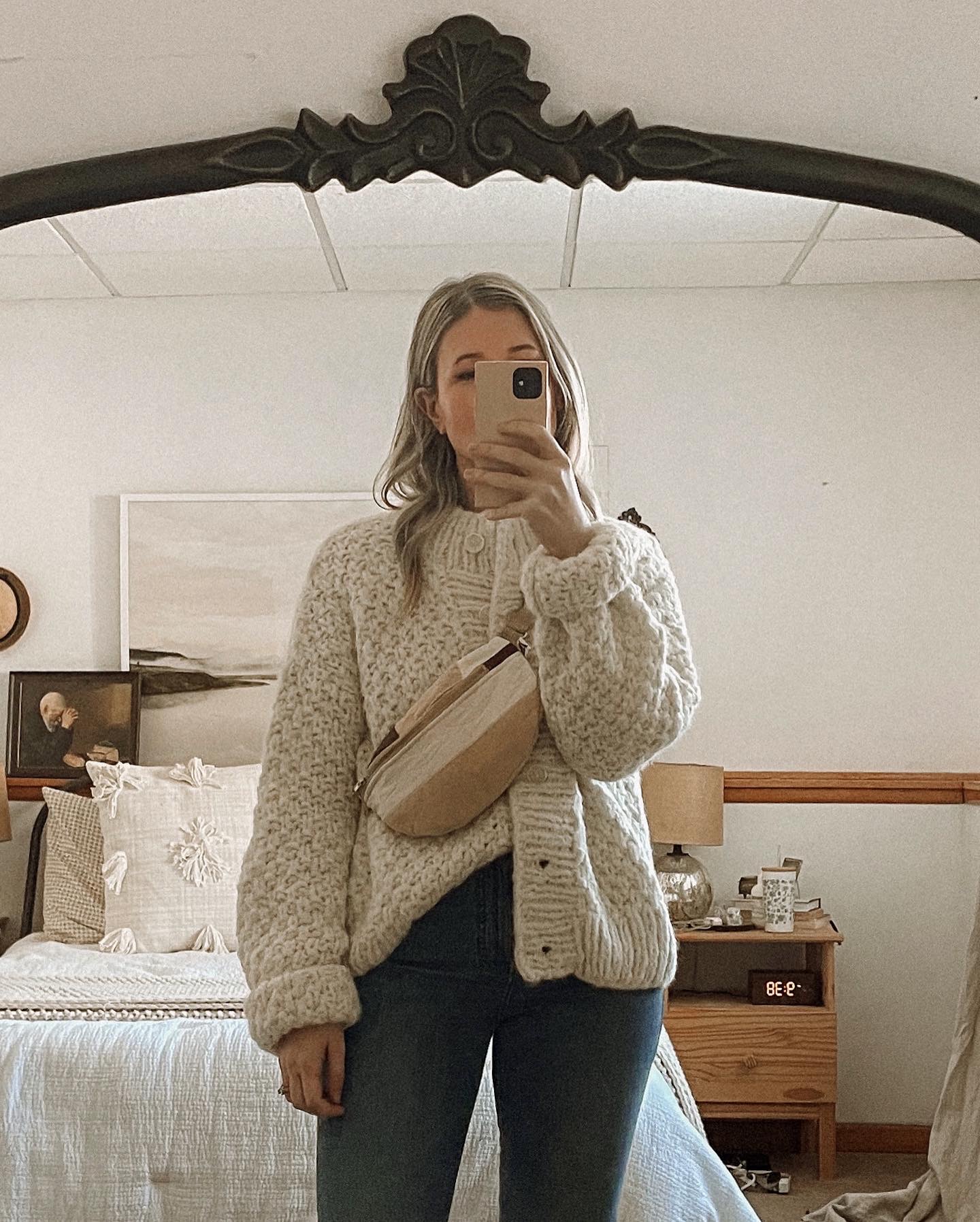 Karin Emily wears a chunky knit sweater from Ozma