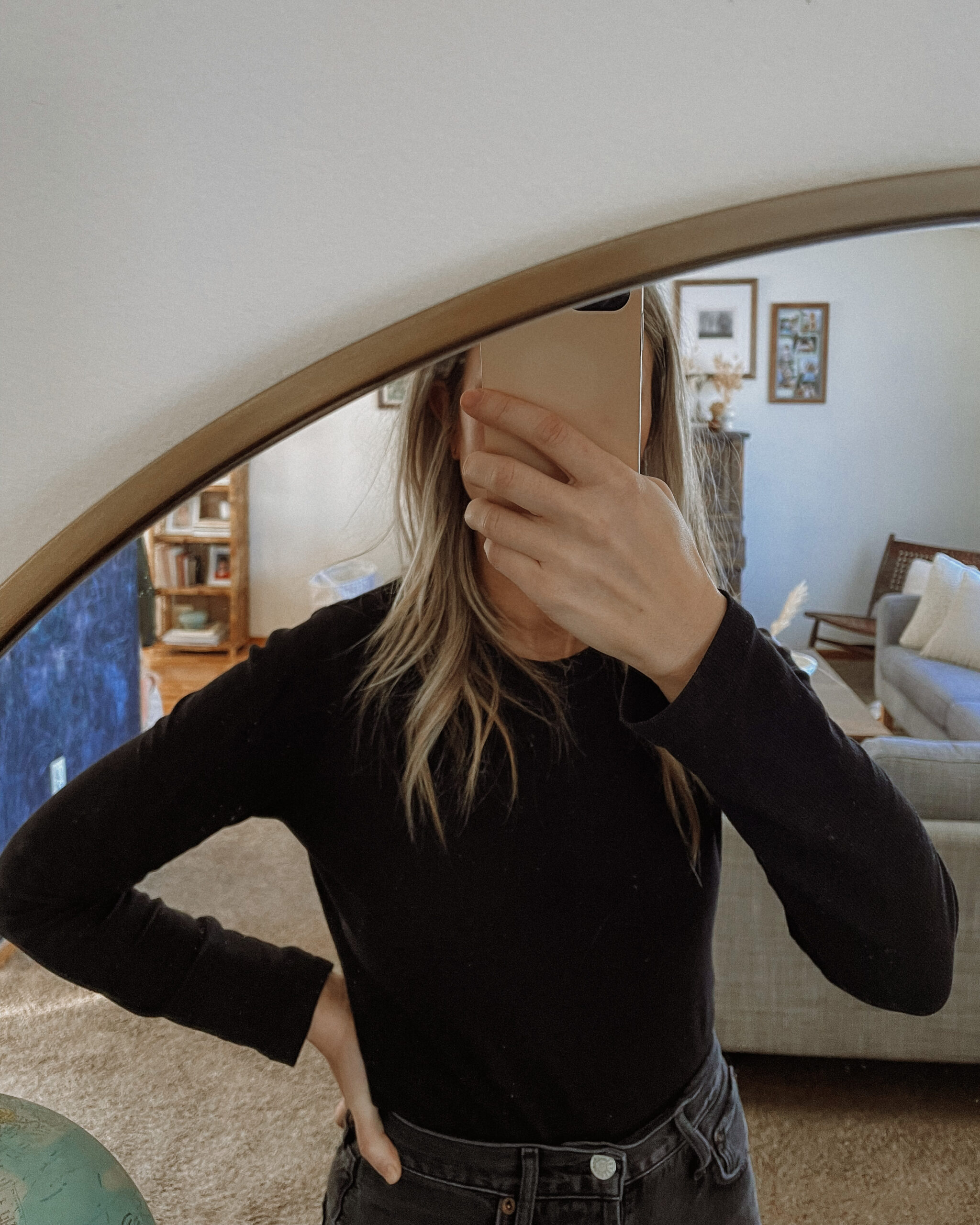 Karin Emily wears a basic ribbed black long sleeve tee