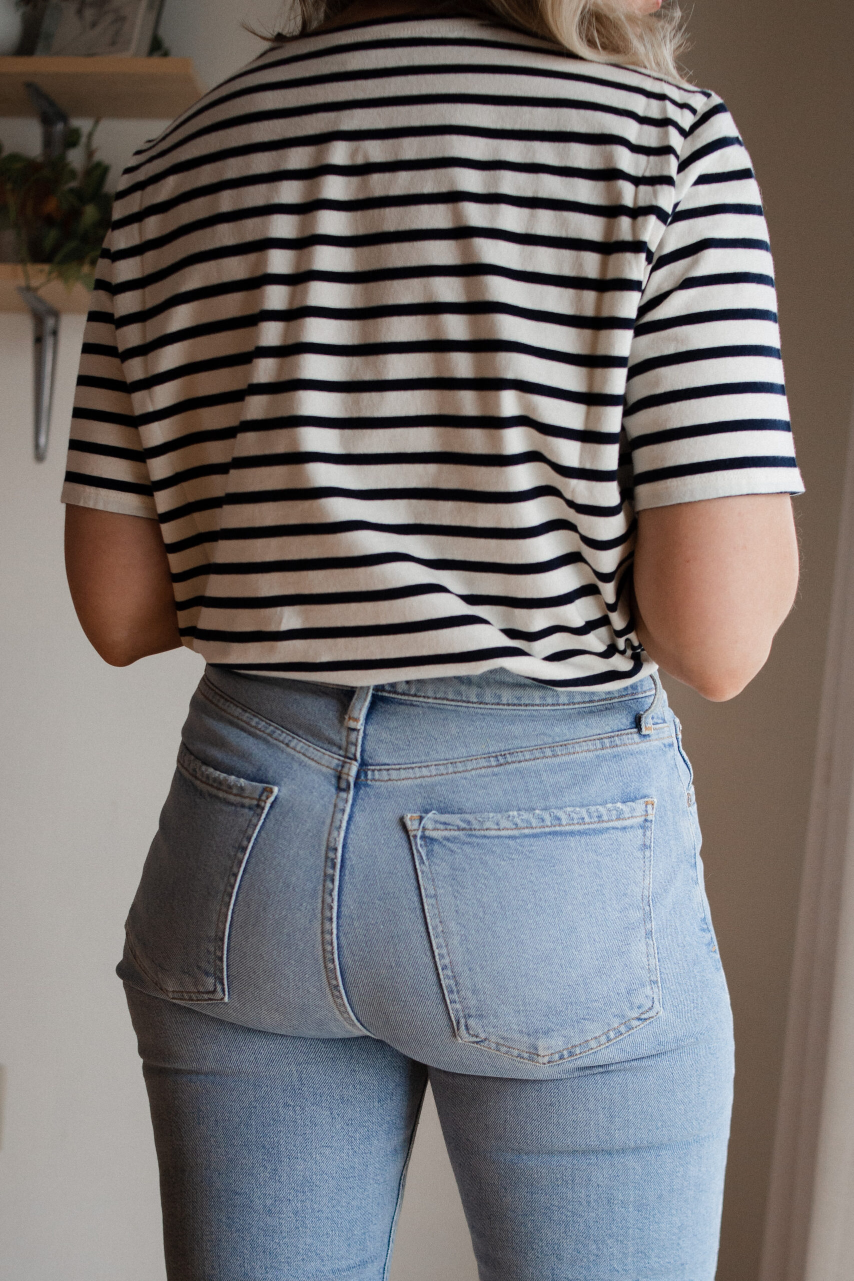 Karin Emily wears a black and white striped tee and the everlane rigid way high jeans for her Everlane Denim Guide