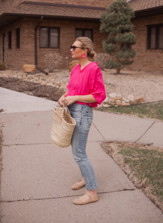 Karin Emily wears a fuchsia linen top from aliya wanek, citizens of humanity charlotte jeans, doen mary jane flats, a hereu basket bag, hand painted flower earrings from the Pink Reef and Isabel Marant Sunglasses