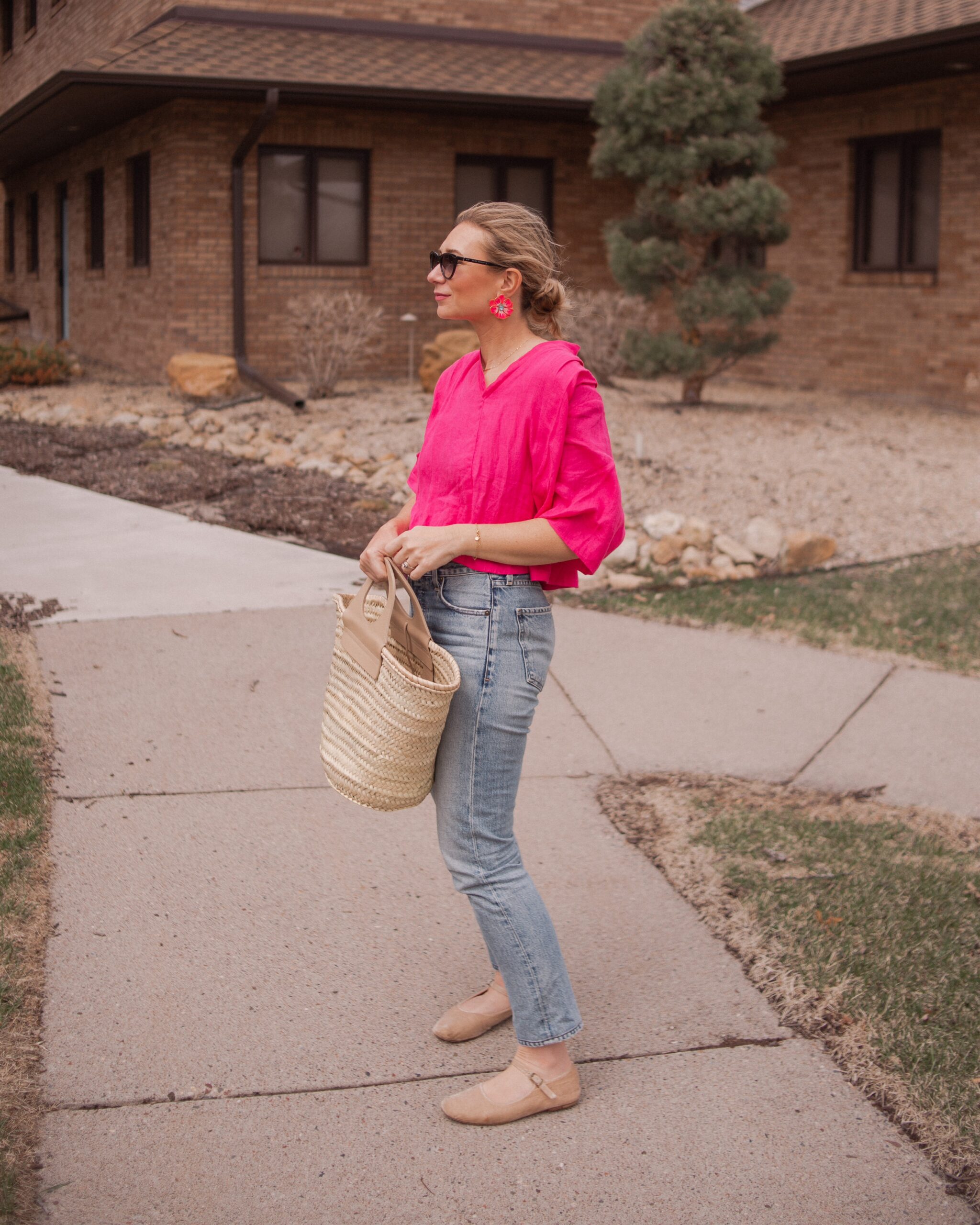 Karin Emily wears a fuchsia linen top from aliya wanek, citizens of humanity charlotte jeans, doen mary jane flats, a hereu basket bag, hand painted flower earrings from the Pink Reef and Isabel Marant Sunglasses 