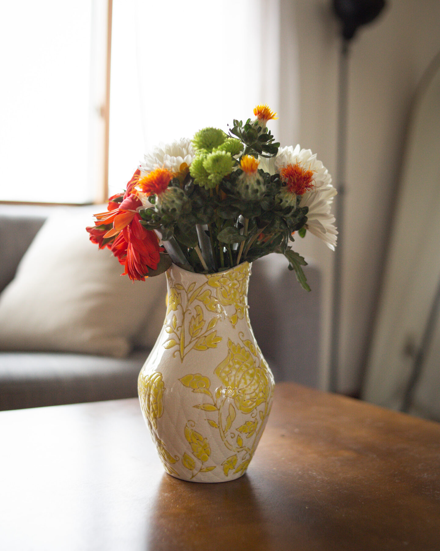 Karin Emily shares a yellow and white ceramic vase for her Mother's Day Gift Guide