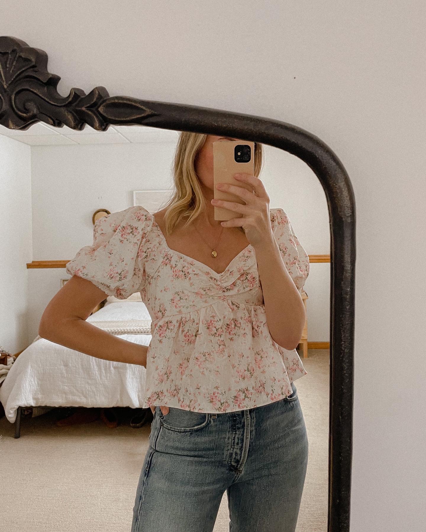 Karin Emily wears a floral sweetheart neckline top from the Shopbop Style Event