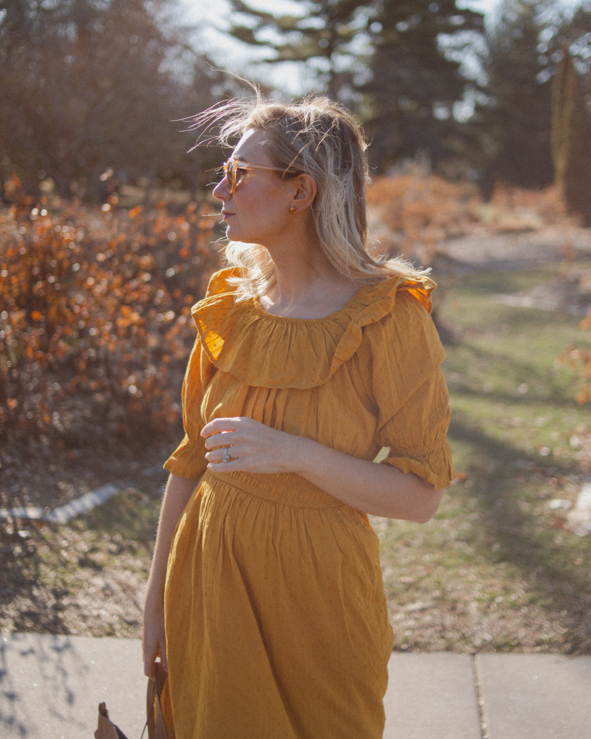 Karin Emily shares her favorites shoes for spring and wears a goldenrod yellow dress