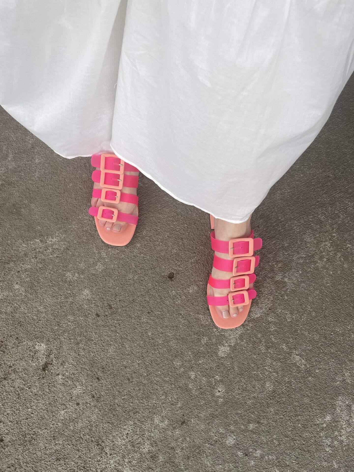 Karin Emily wears a pair of pink jelly sandals
