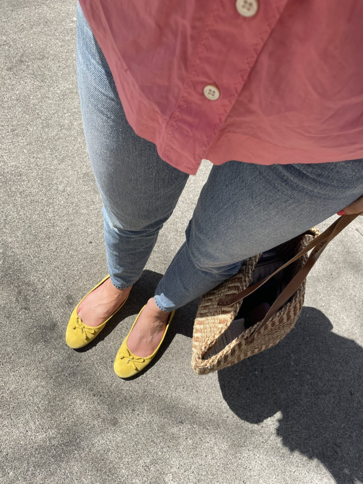 Karin Emily wears a yellow pair of flats from Sam Edelman