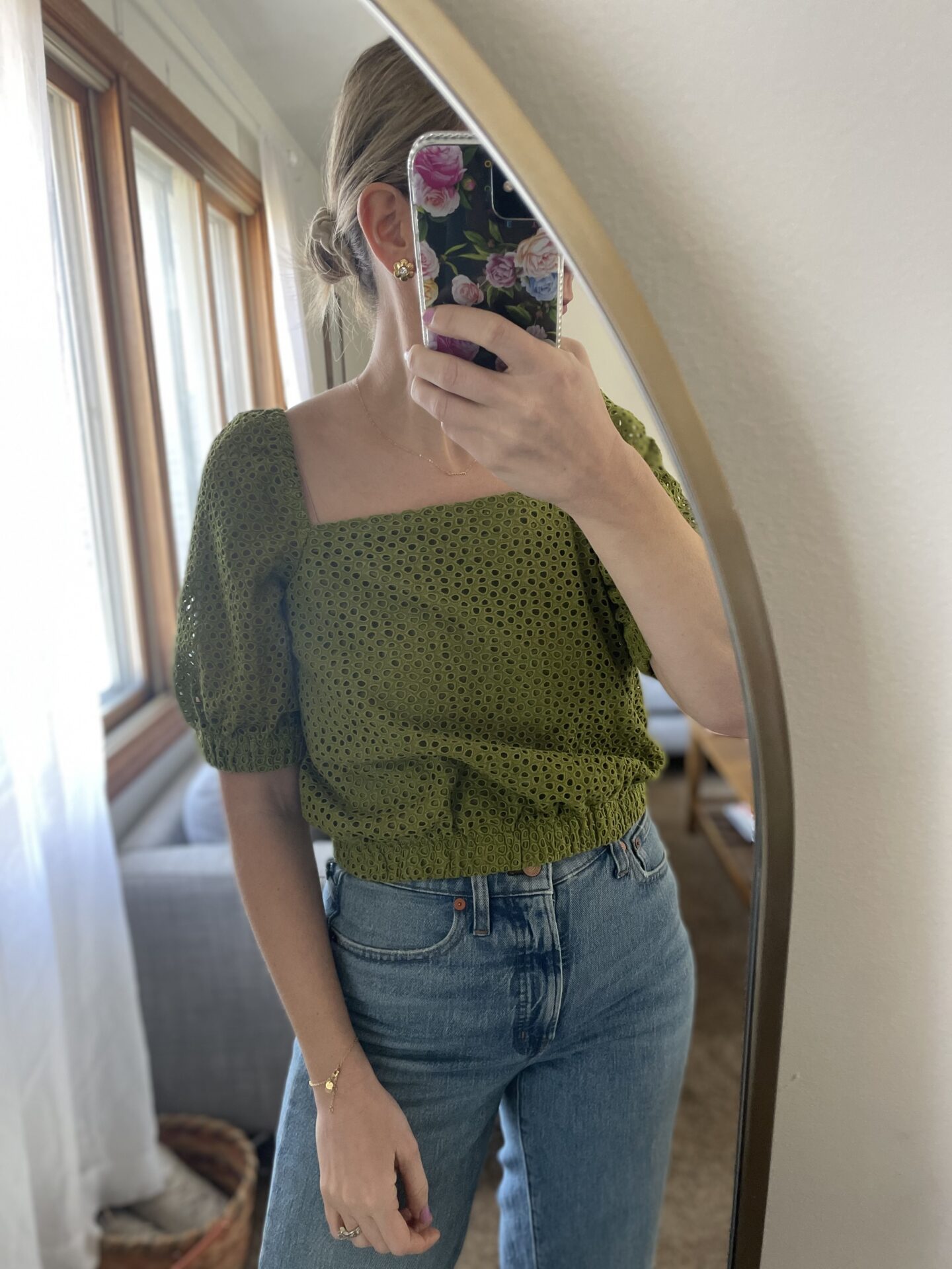 Karin Emily wears her Everlane favorites: a green eyelet puff sleeve blouse