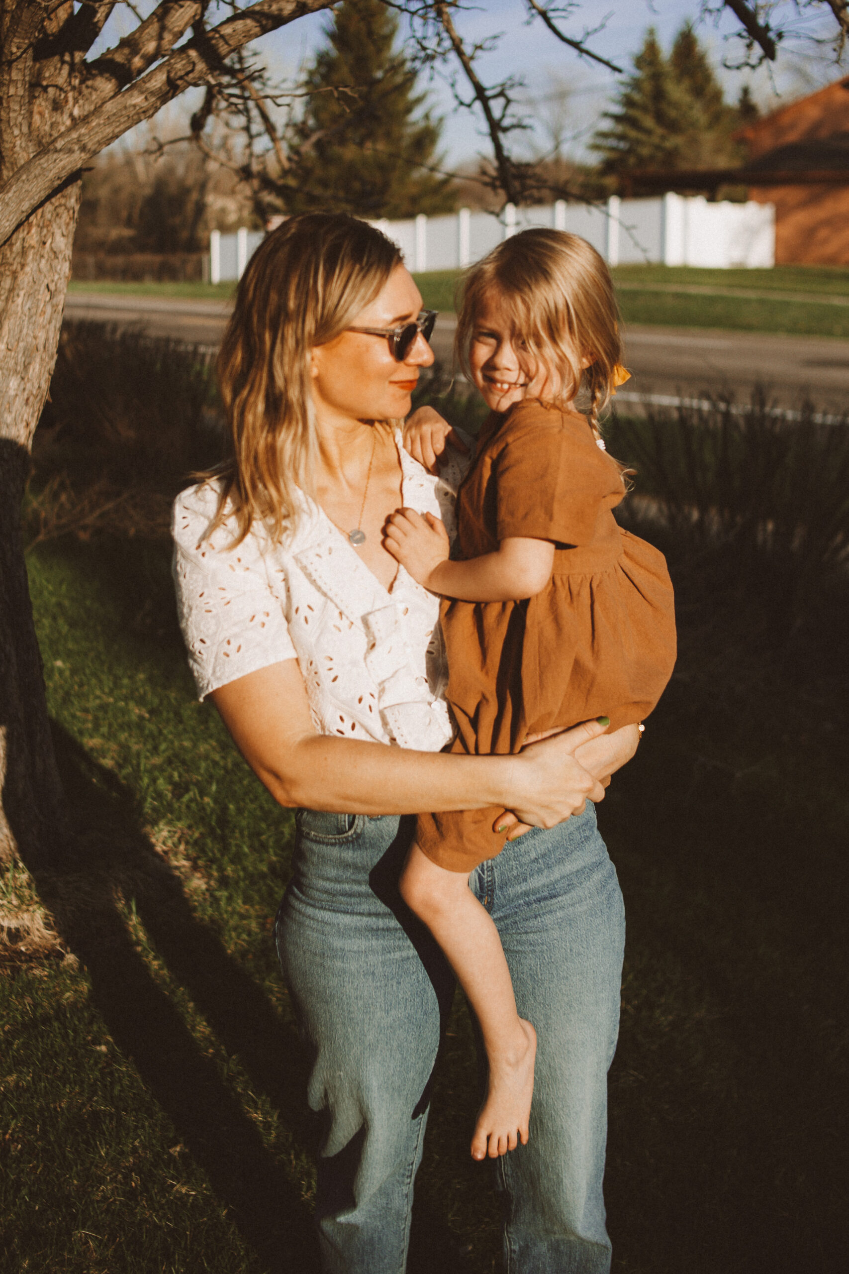 Karin Emily wears a white sezane top and wide leg Madewell jeans