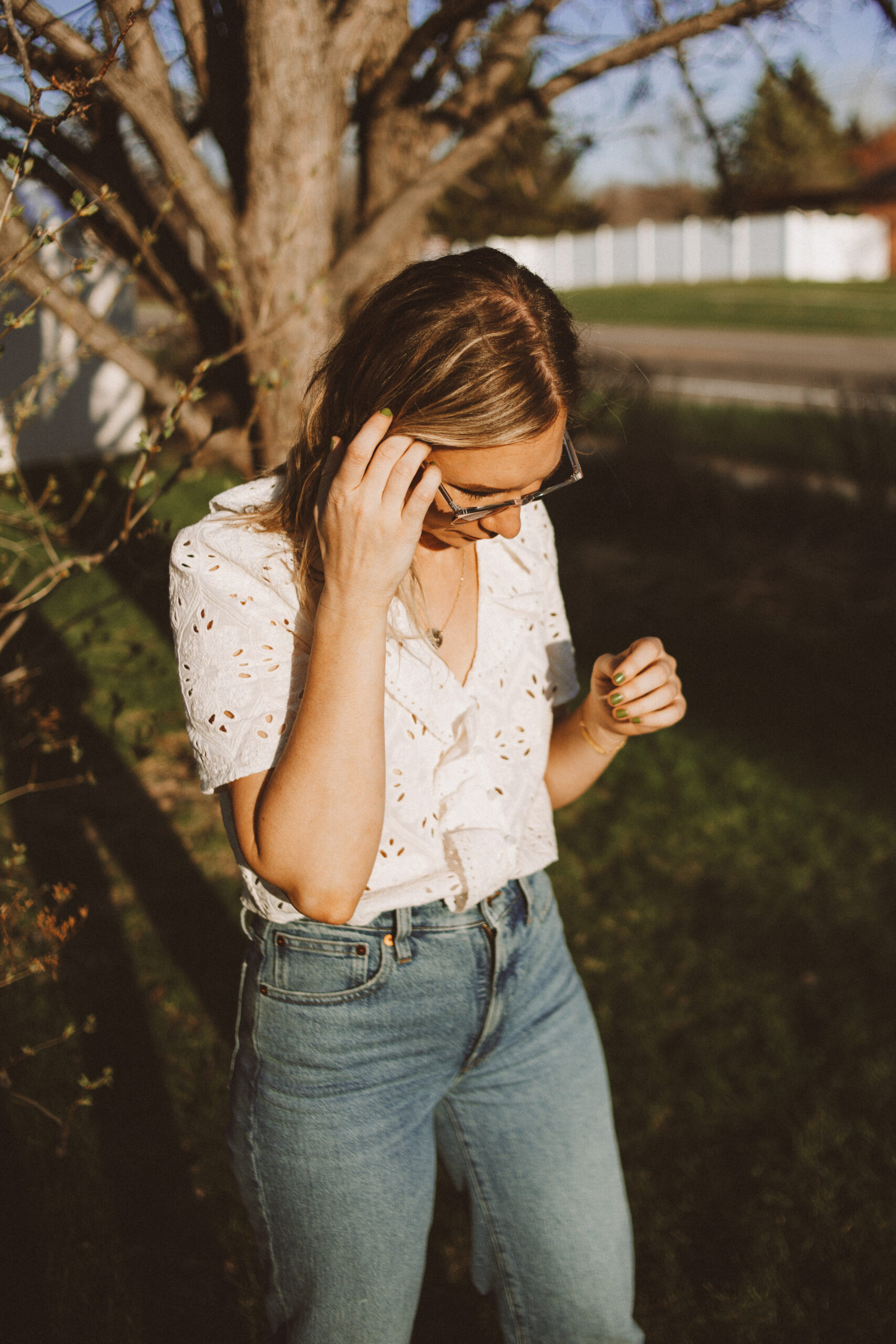 Karin Emily wears a white sezane top and wide leg Madewell jeans