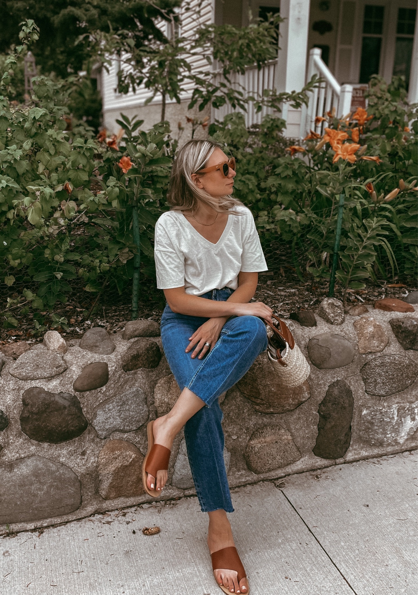 Karin Emily wears her Everlane favorites: a pair of way high jeans and a basic cream tee