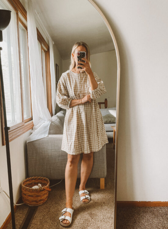 Karin Emily wears a gingham mini dress as part of an ABLE Spring Try On
