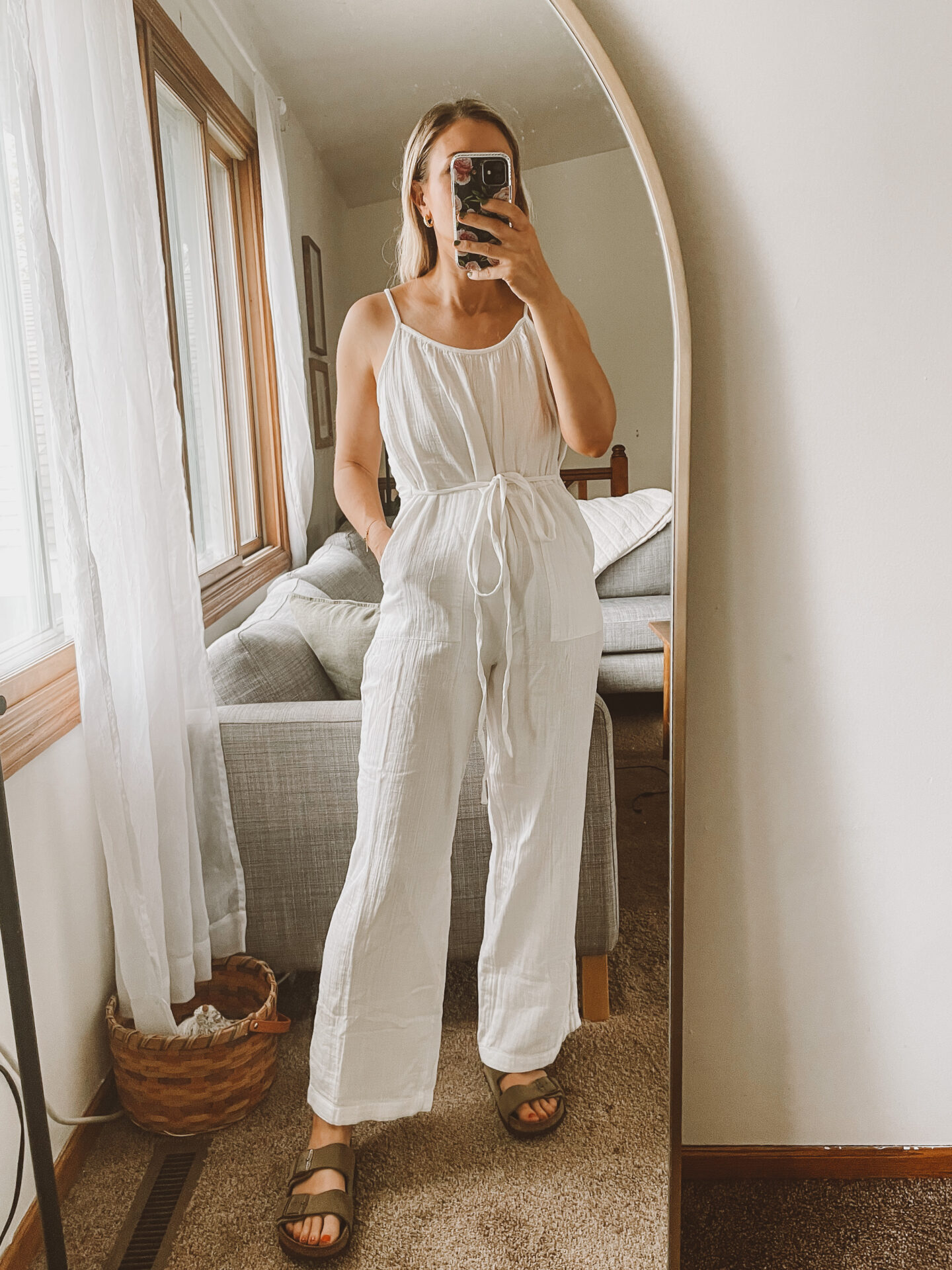 Karin Emily wears a white gauze jumpsuit from the Gap