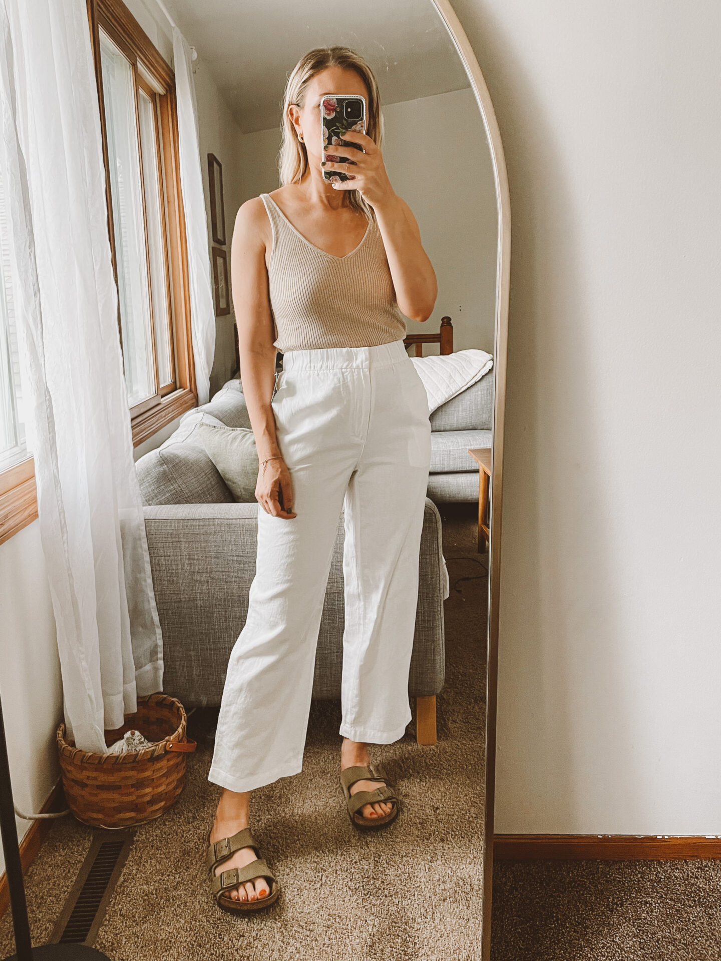 Karin Emily wears a pair of white linen pants from the Gap