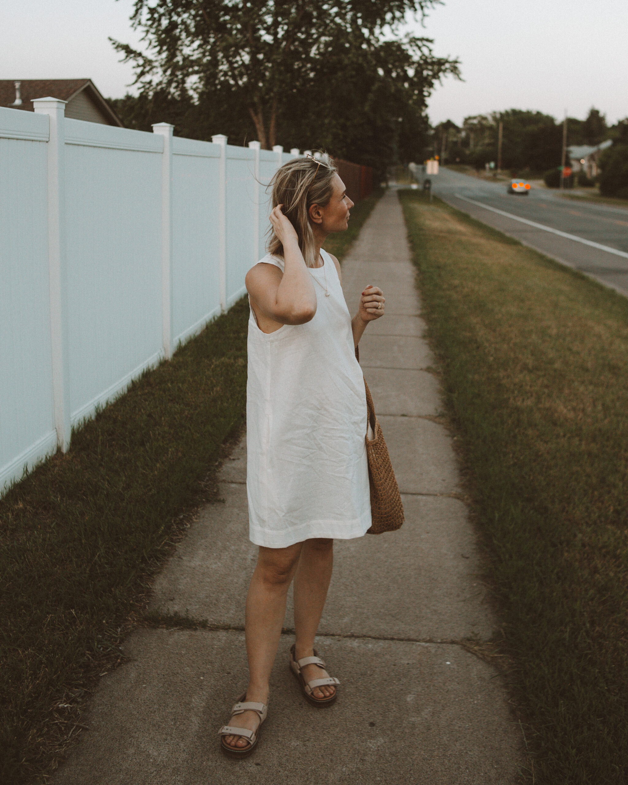 Karin Emily wears one of her favorite hot weather staples - a little white linen dress 