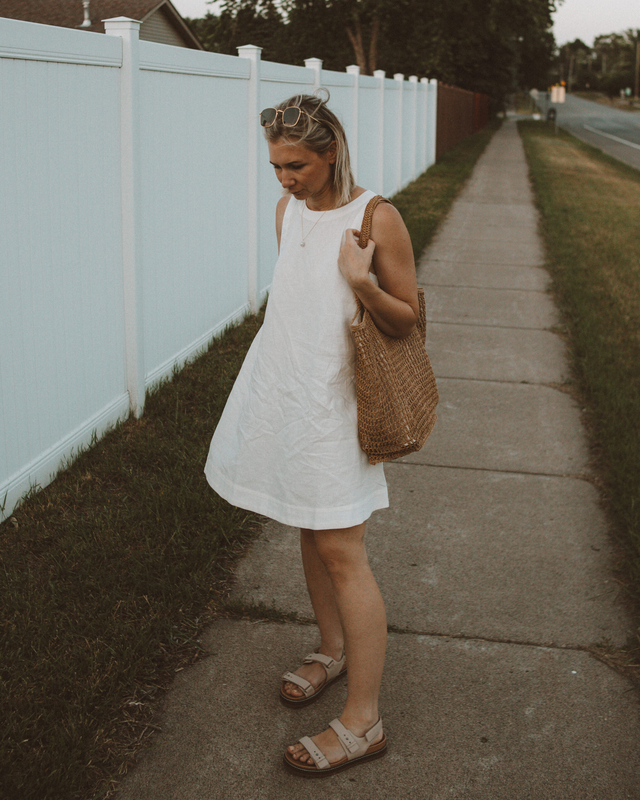 Karin Emily wears one of her favorite hot weather staples - a little white linen dress