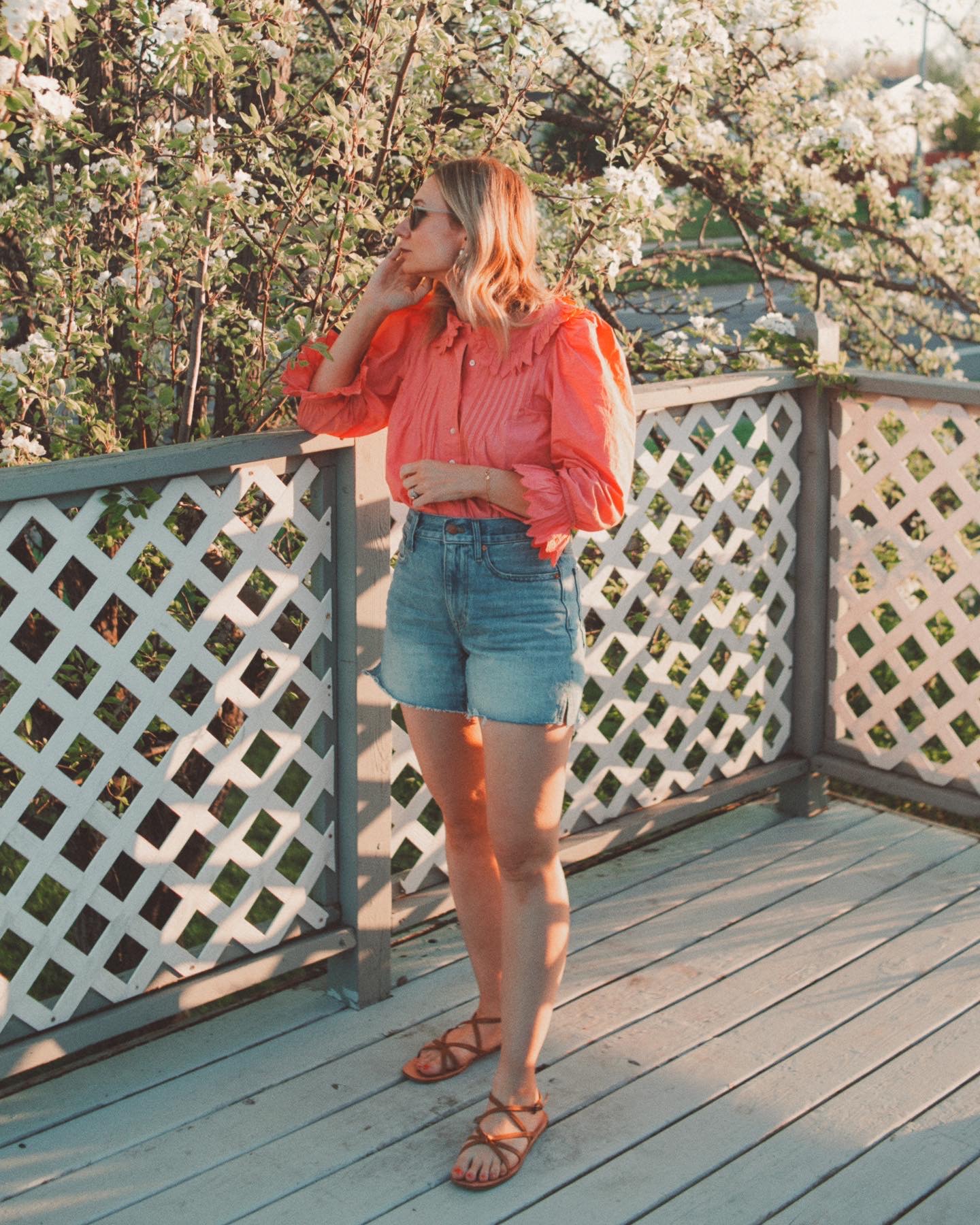 Karin Emily wears her favorite denim shorts with a pink blouse