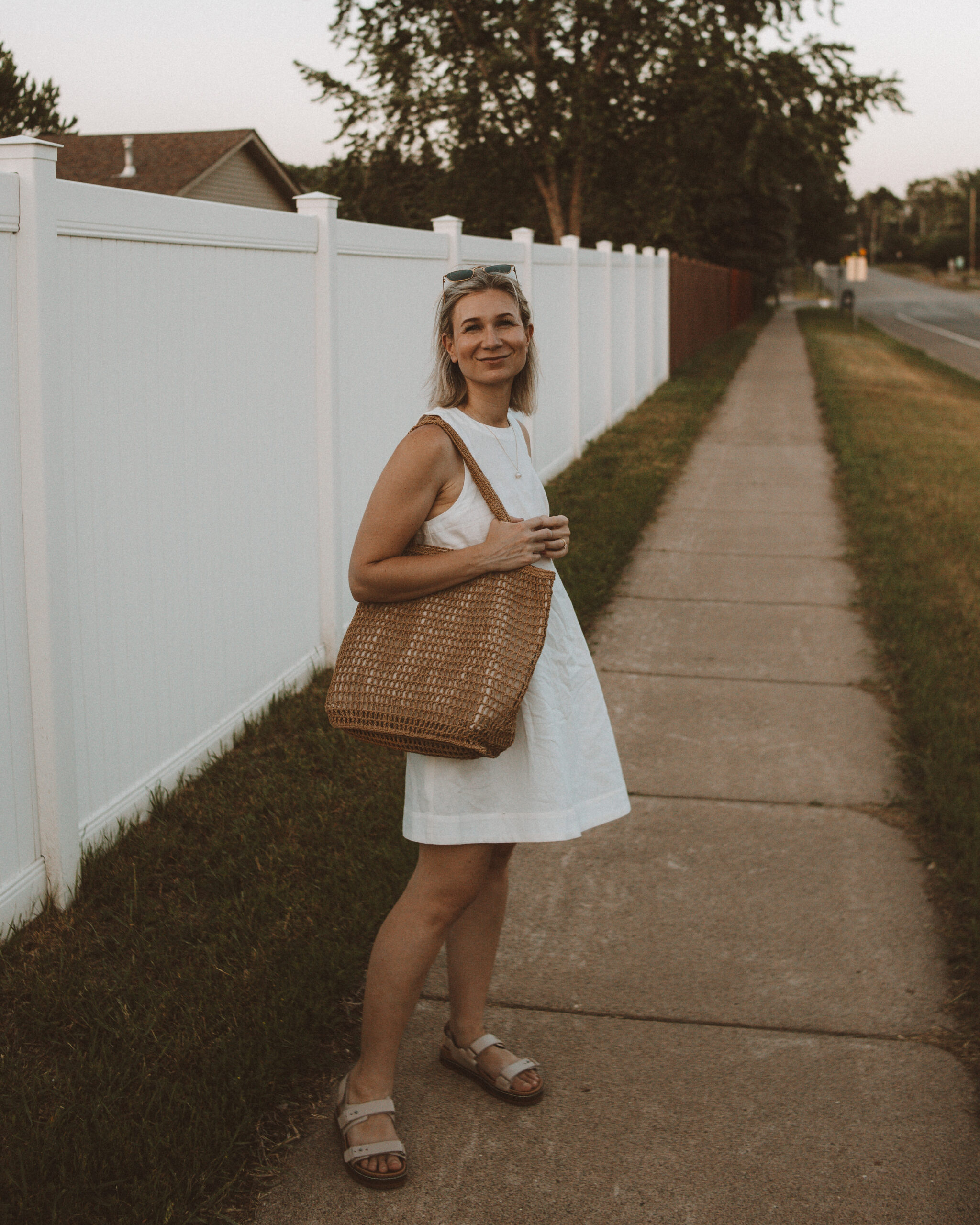 Karin Emily wears one of her favorite hot weather staples - a little white linen dress 
