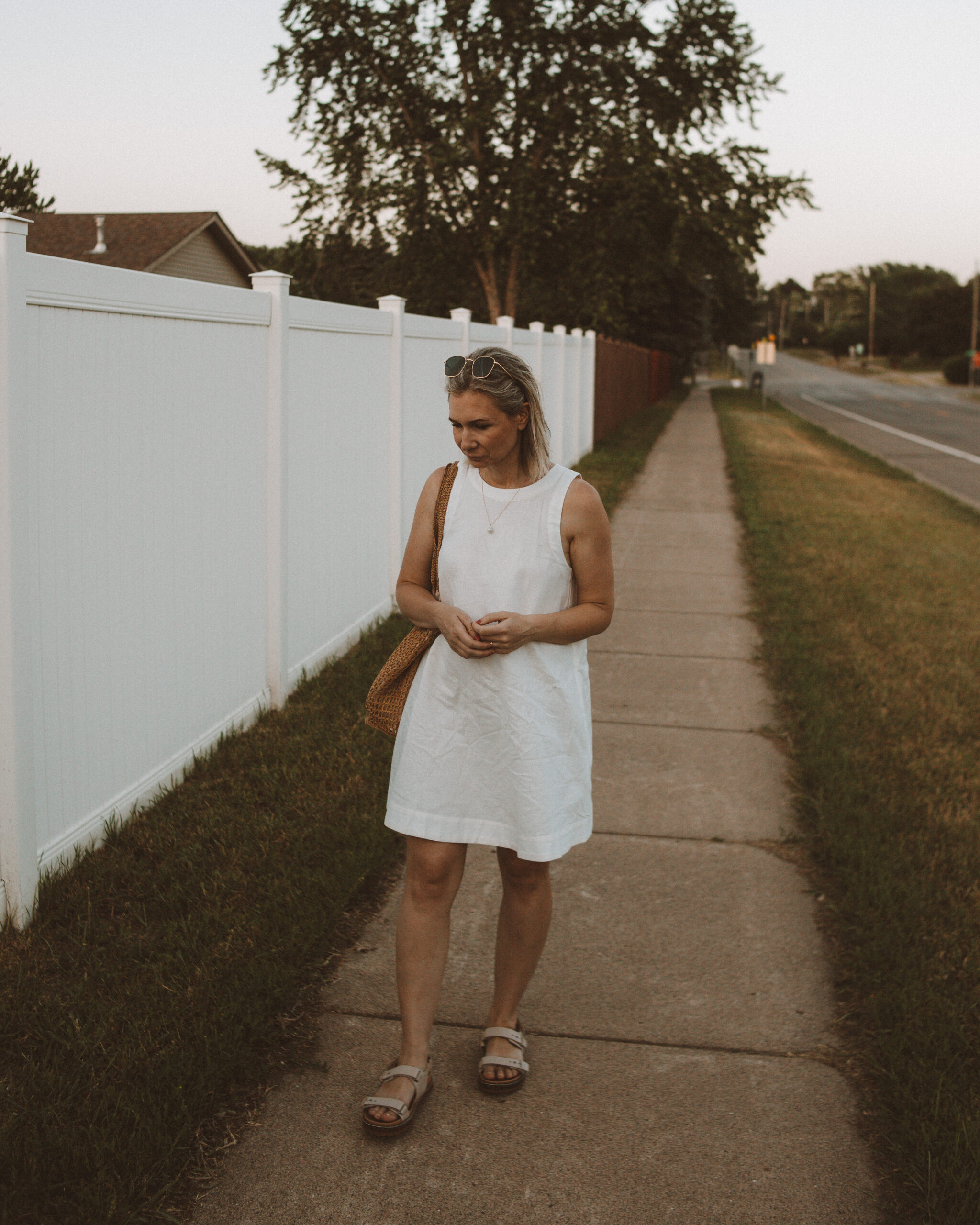 Karin Emily wears one of her favorite hot weather staples - a little white linen dress