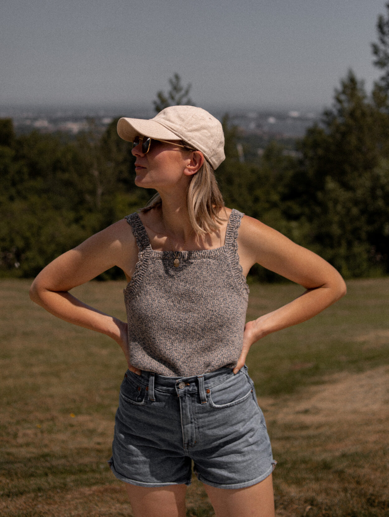 Karin Emily wears a late summer pick from Sezane: asweater tank from Sezane with Madewell mom shorts and Birkenstock Arizona Sandals