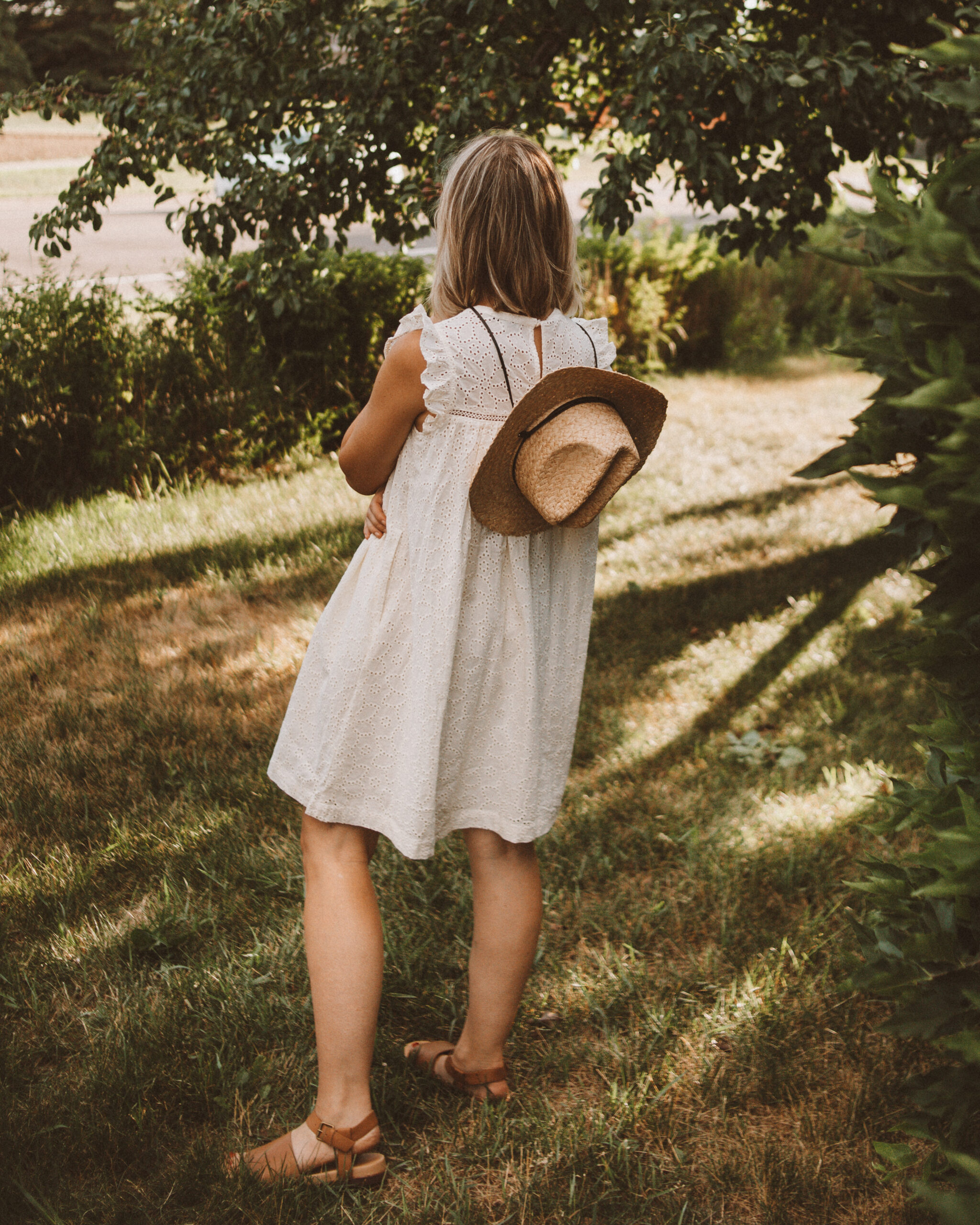 Karin Emily wears an eyelet dress from the Madewell Secret Stock Sale