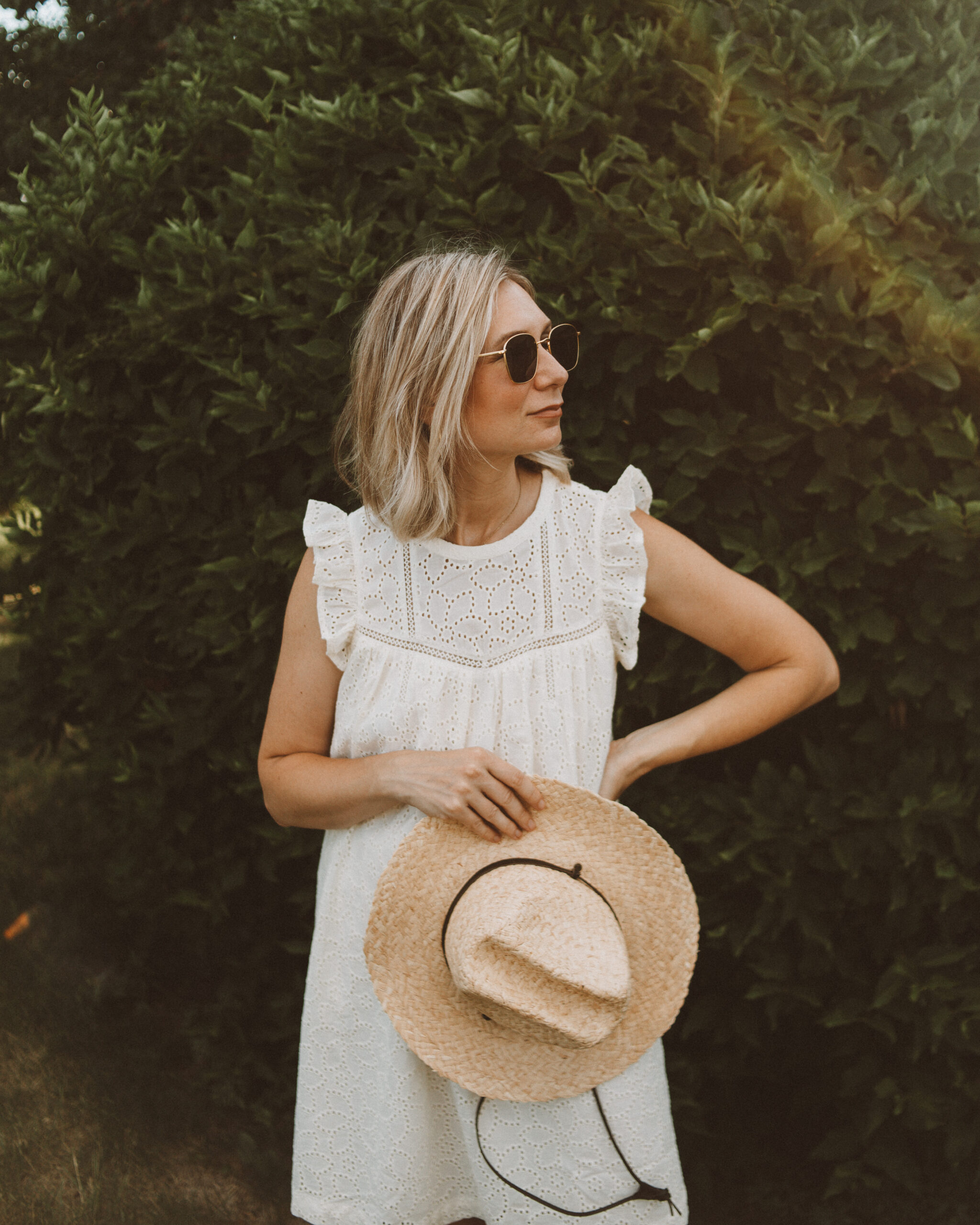 Karin Emily wears an eyelet dress from the Madewell Secret Stock Sale