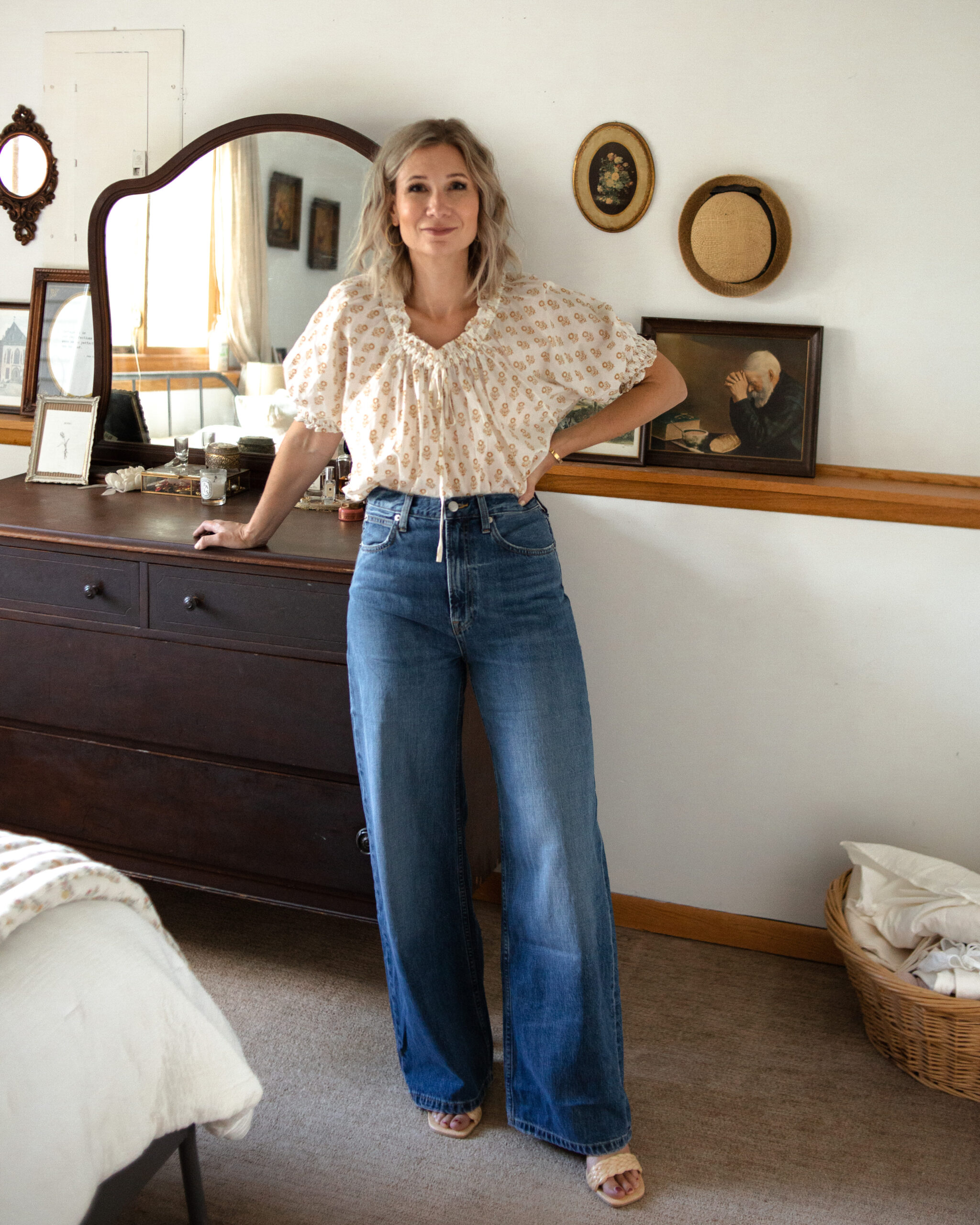 Karin Emily is wearing the Baggy Jean from Everlane with a Doen floral blouse