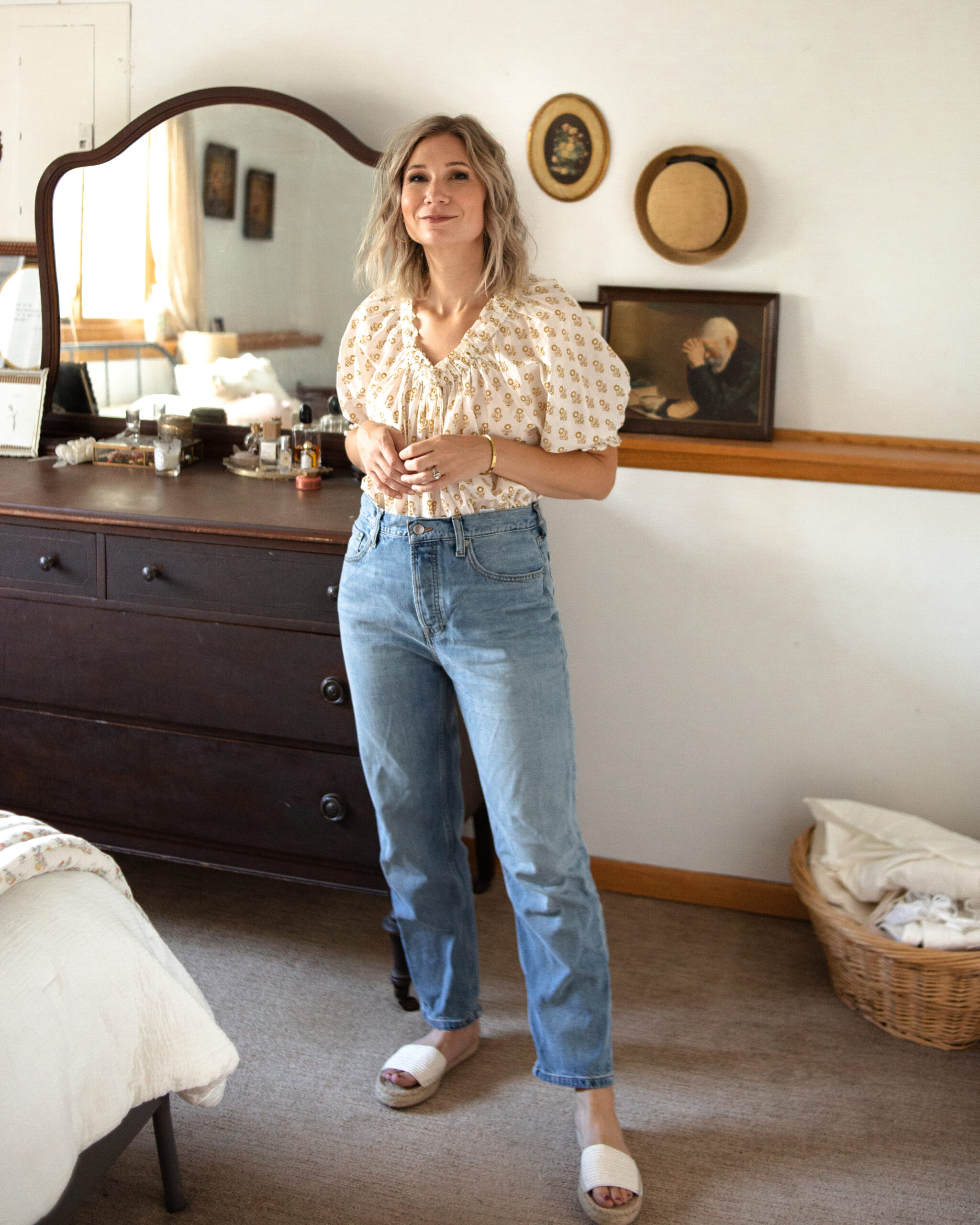 Karin Emily is wearing the Summer Slouch Jean from Everlane with a Doen floral blouse
